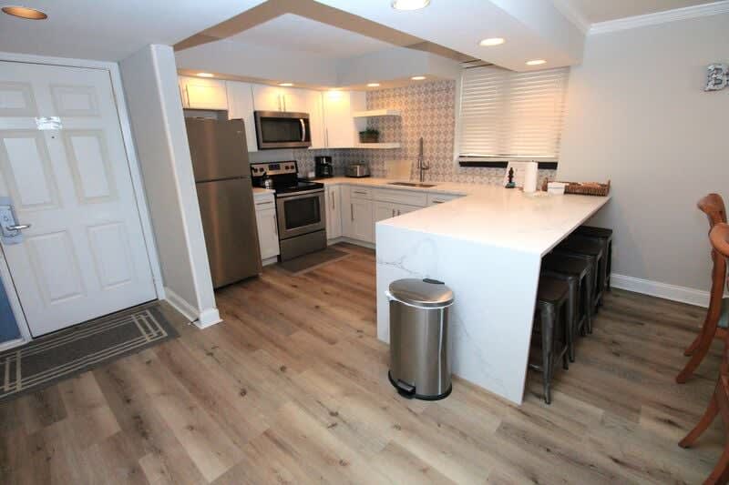 View of the remodeled kitchen and barstools