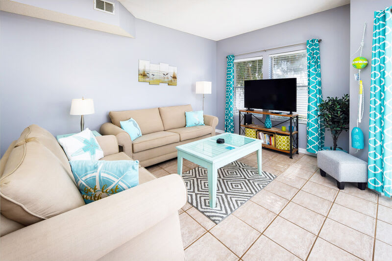 Living Room with walk out patio - 
Sandpiper Cove Resort 9106 Holiday Isle Destin Florida Vacation Rentals