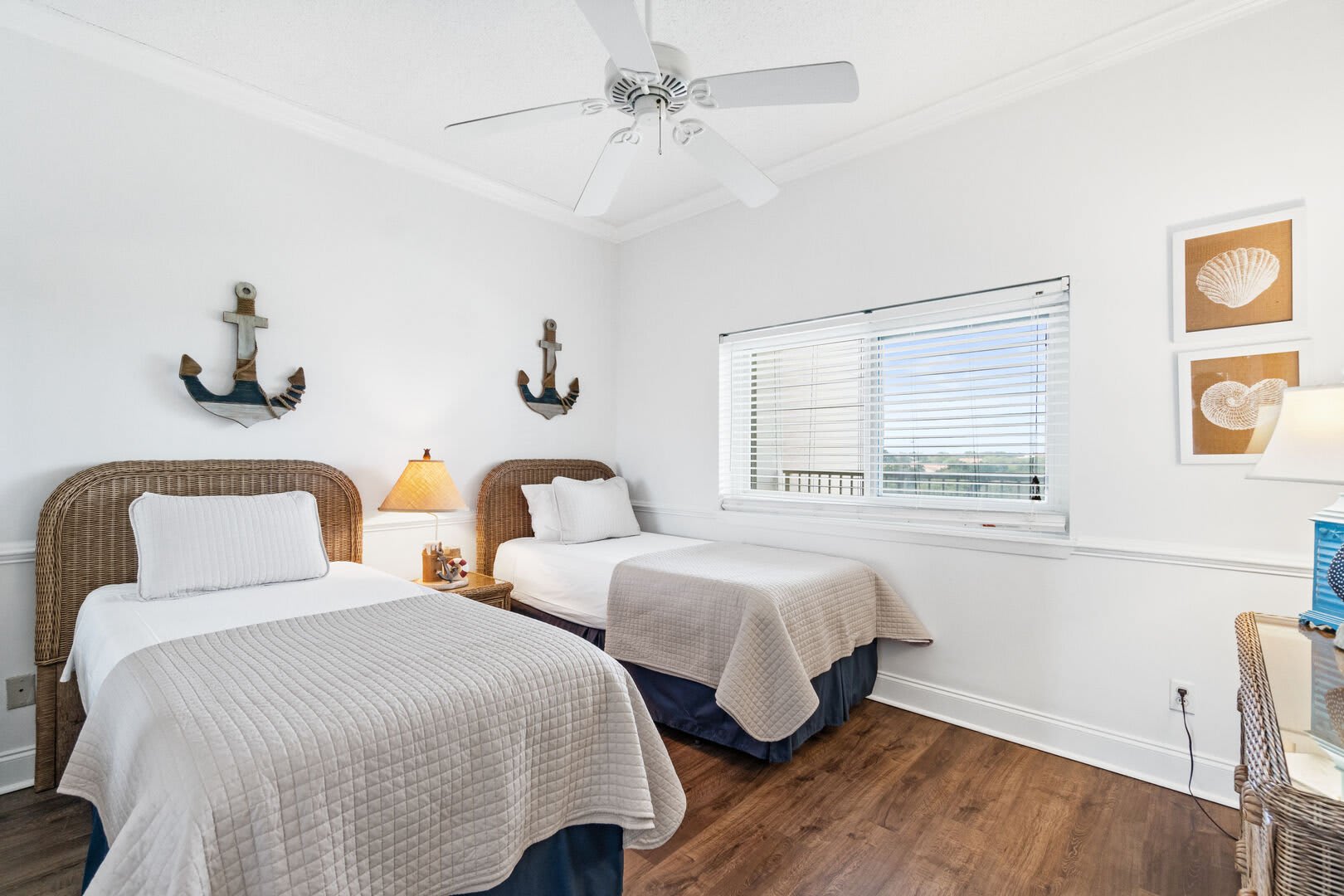 Guest room provides 2 twin beds with fresh crisp linen on plush mattresses with fully pillows. A ceiling fan to keep you cooler on the hot summer nights.