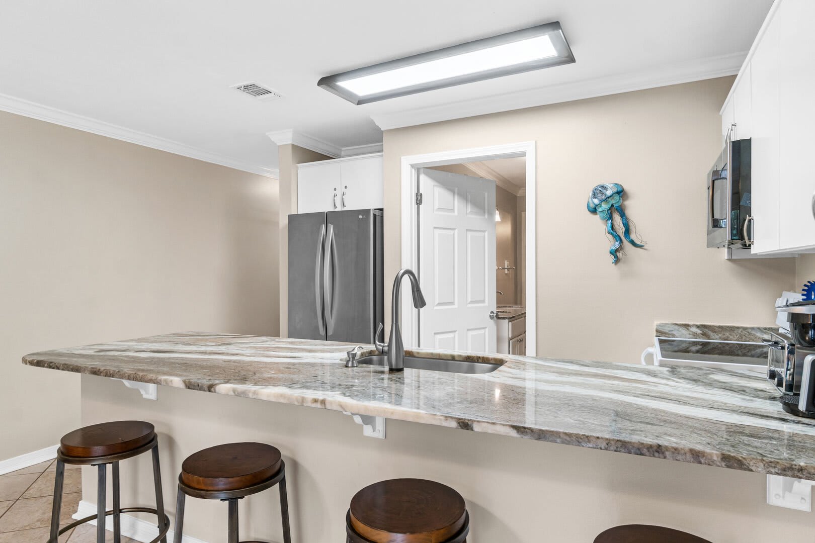 This kitchen may be small, put it provides everything you need to cook, bake, or just serve a beverage.  All needed wares available for use.