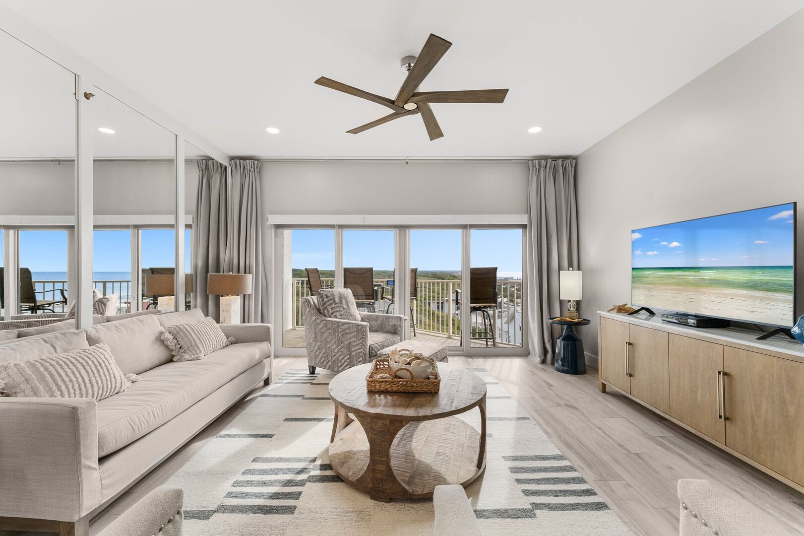 Living room provides comfy and casual seating, large screen Tv, ceiling fan and a sliding door to your 7th floor private balcony.