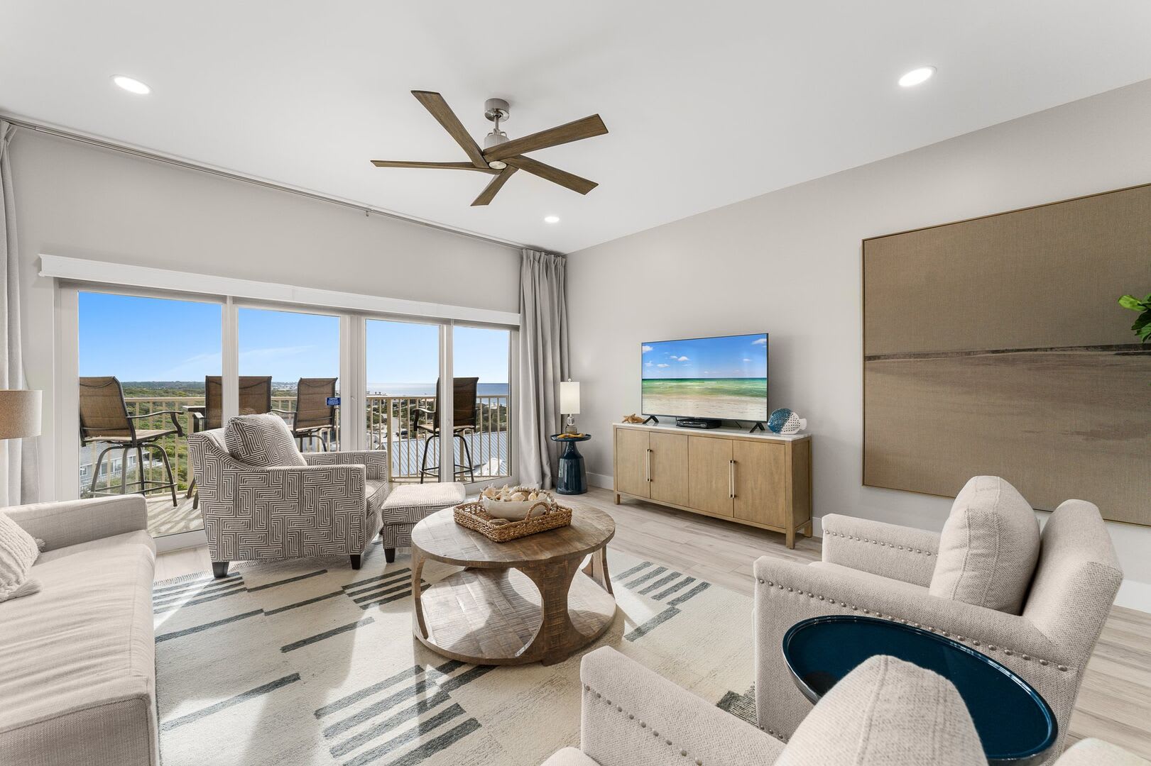 Spacious living room with comfy sofa, club chairs and a oversized club chair with ottoman to watch your favorite shows or just catch up on the daily news events.