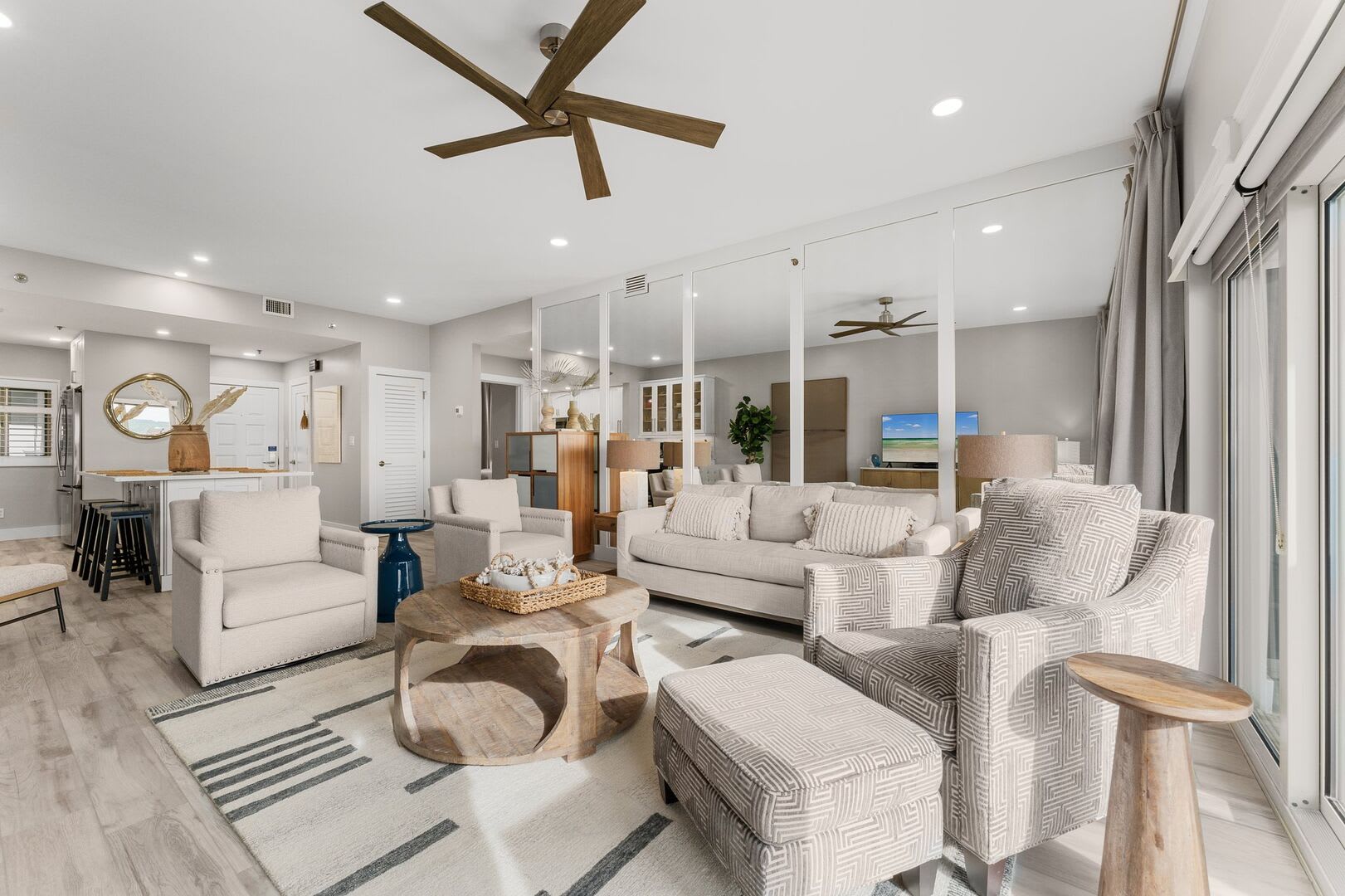 Living room with mirrored wall to give you an overall spacious feel while relaxing or taking a well deserved nap. Room enough to seat 6.