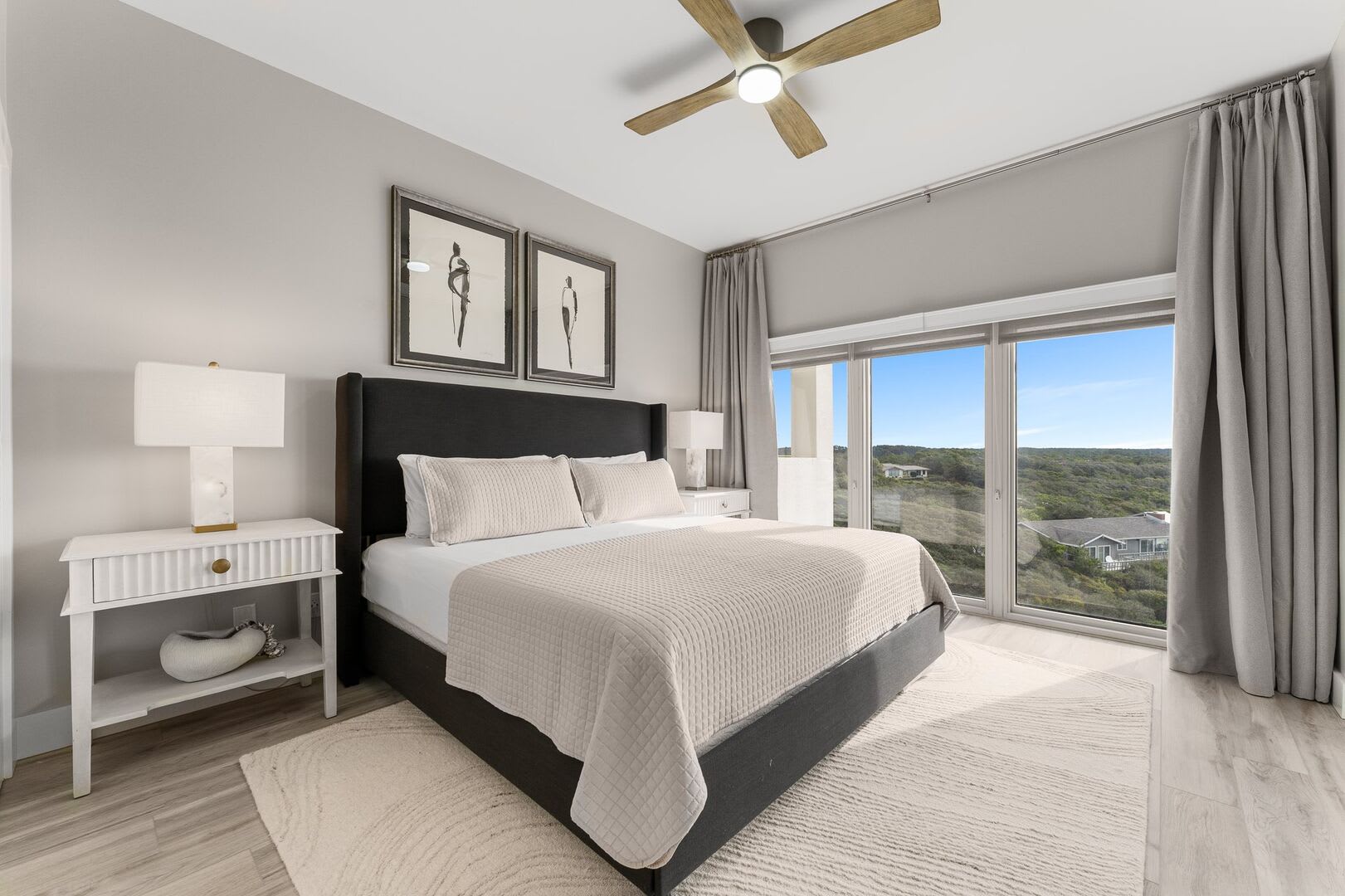 Master suite with king size bed, 2 night tables and lamps, ceiling fan for warm summer nights and floor to ceiling windows for that perfect beautiful view.