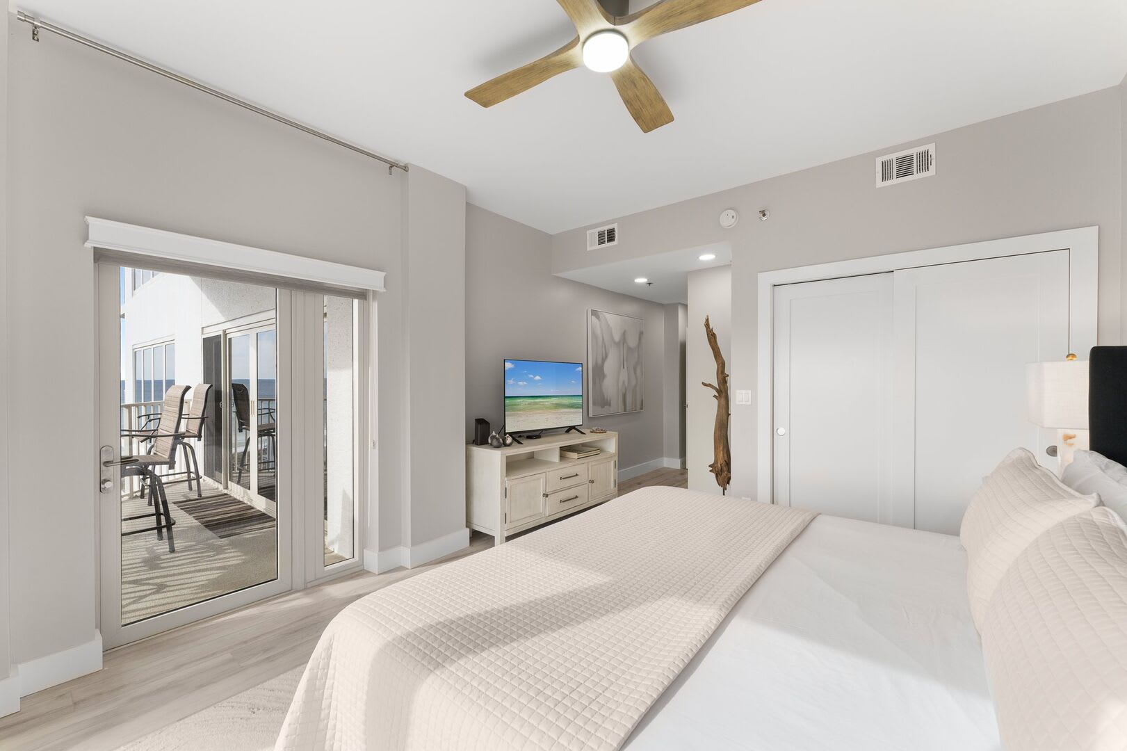 View of private balcony, double closet and TV.