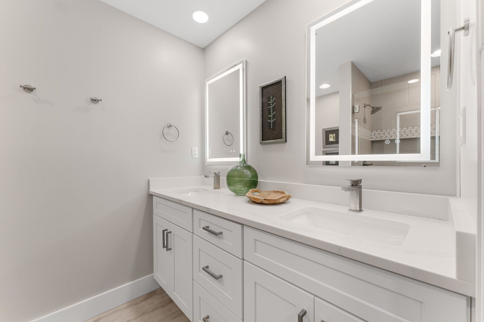 Master bath provides a double vanity, two lighted mirrors and plenty of cabinet storage for all your bathroom necessities.