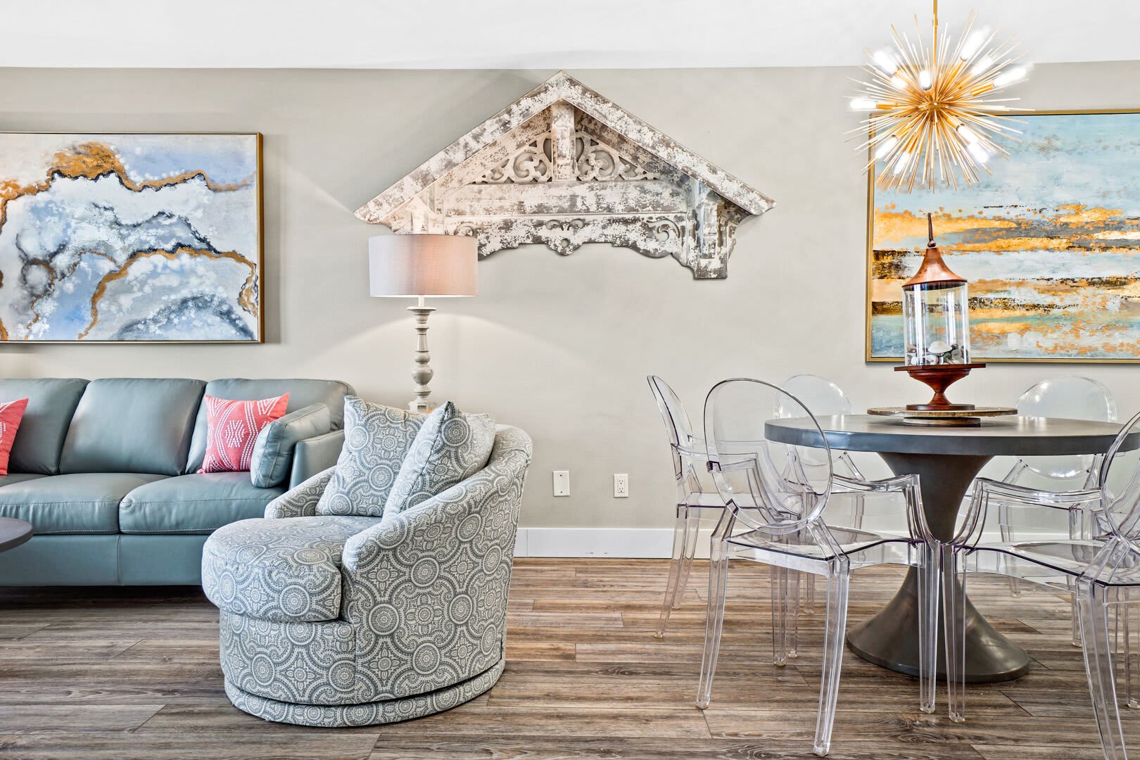 You will find a contemporary style dining table that seats 6. Enjoy the beautiful scenic art work while dining in.