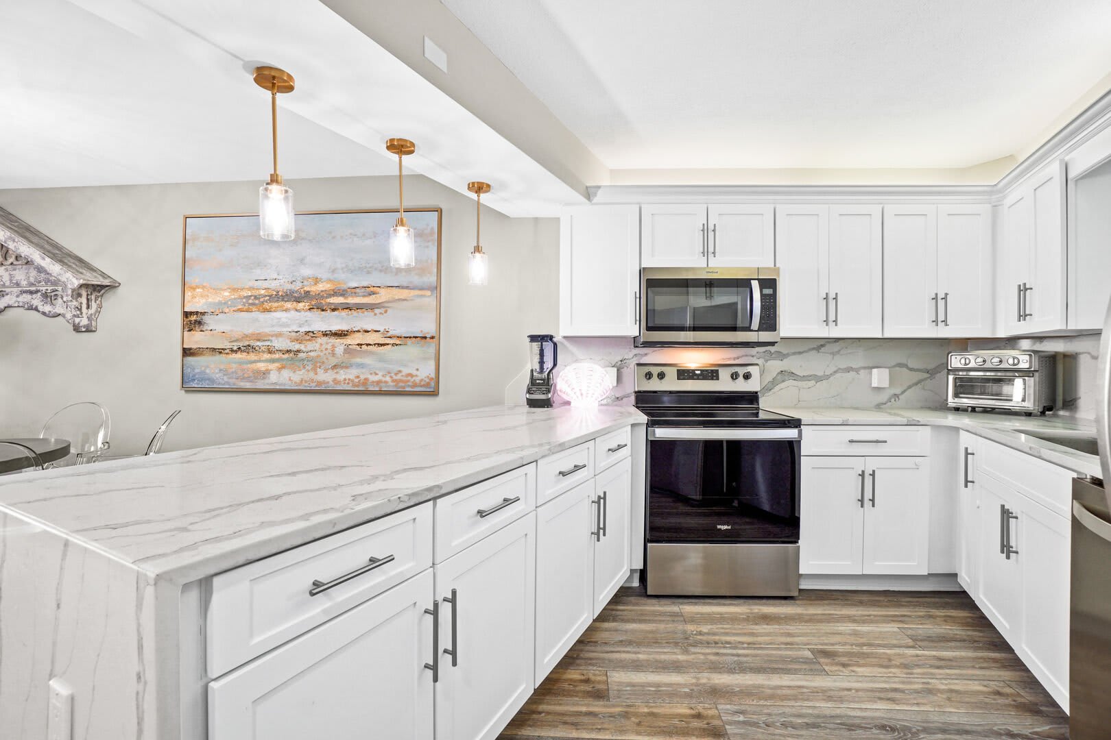 Great kitchen space for entertaining, dinner-in or what ever you have planned during your stay. It has a coffee maker, blender, toaster/convection oven along with a full range/oven combo, microwave, dishwasher and refrig. All the dishes, glassware and coo
