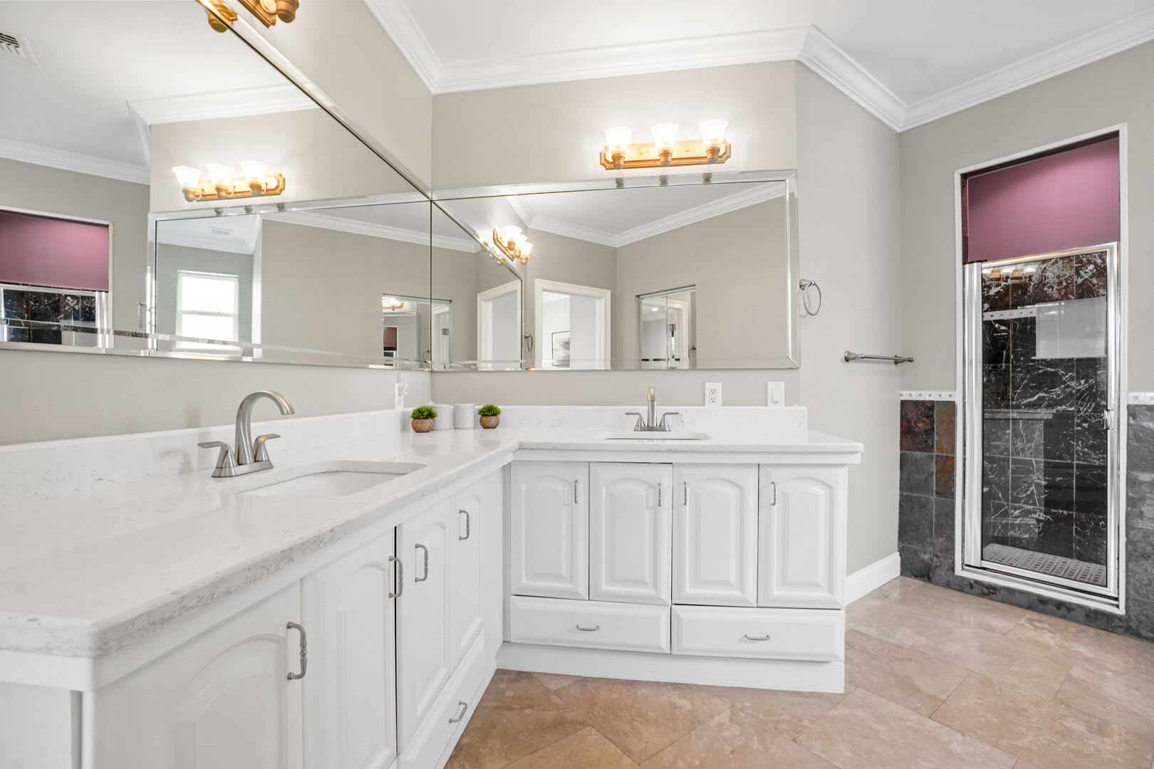 View of the double vanity, and step in shower.
