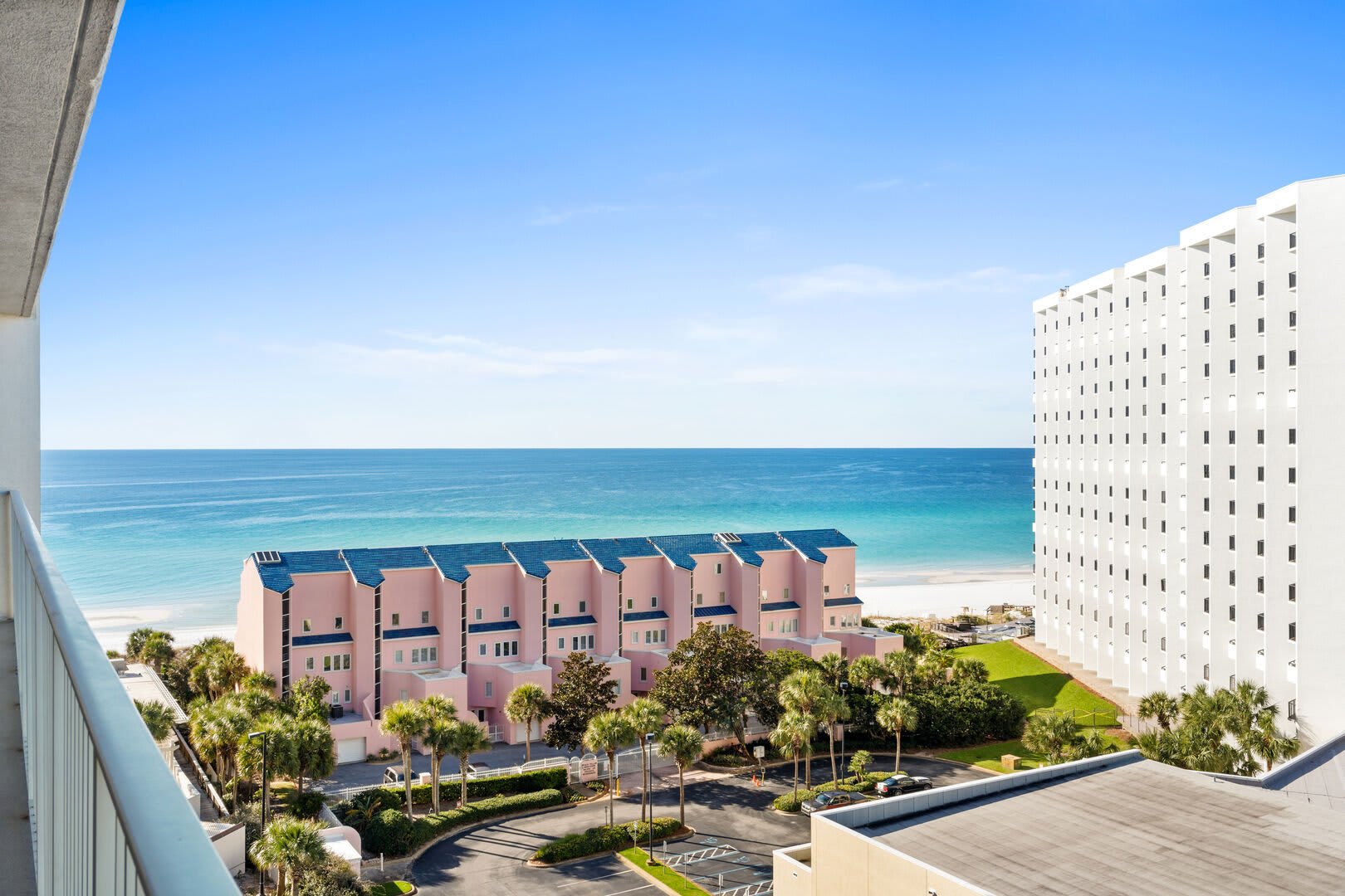 Outside on balcony view of water and other resorts