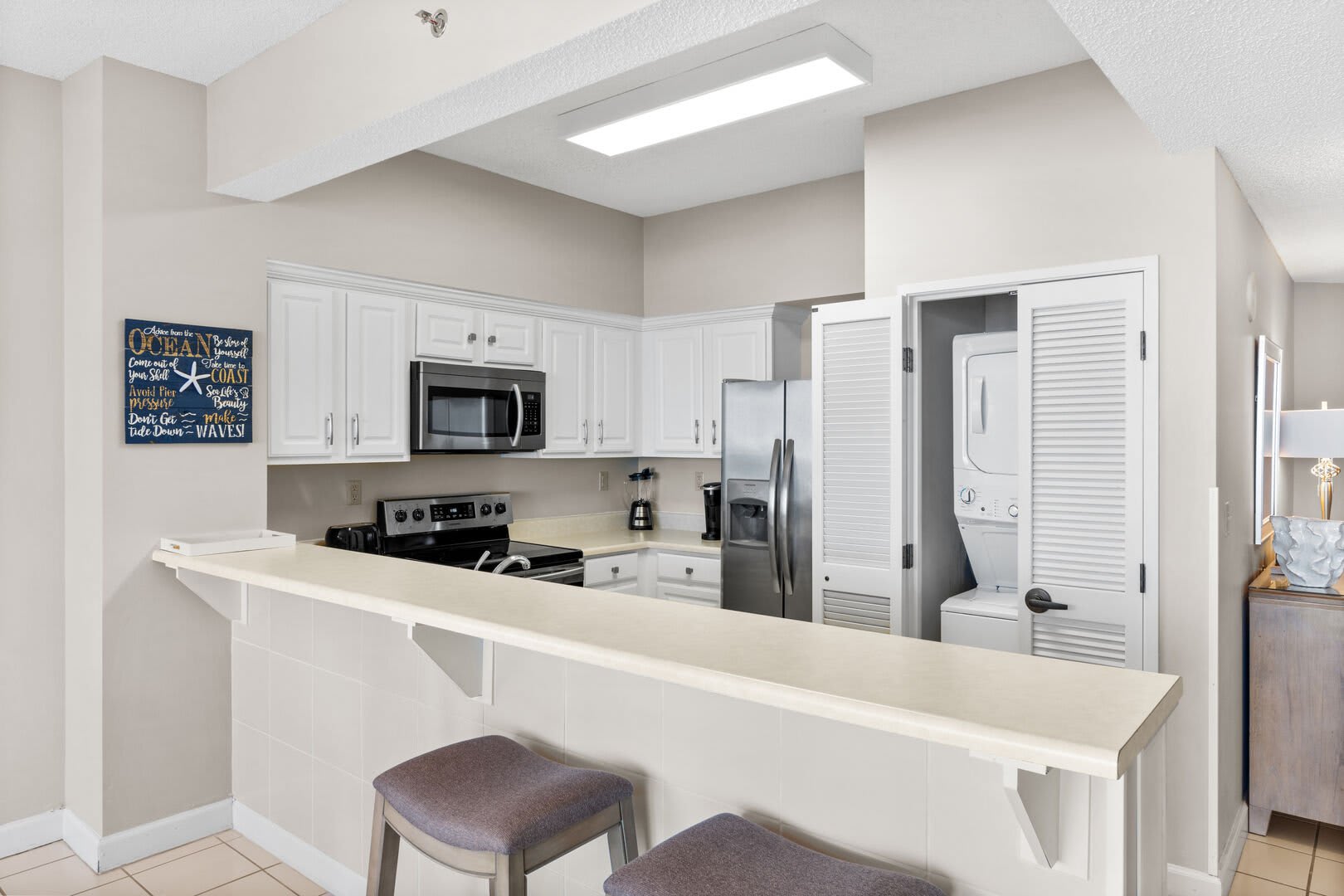 Full size kitchen with large and small appliances, cookware, dinnerware, drinkware, etc. It even provides a stacked washer and dryer for your convenience.