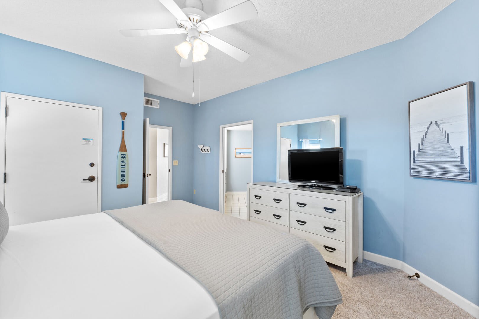 There is a 6 drawer dresser, and flat screen tv with cable and you also have free wifi. Enjoy the soft blue tones and decor that will surely remind you that you are at the beach.  Note the ceiling fan for those warm summer nights and private entry to your