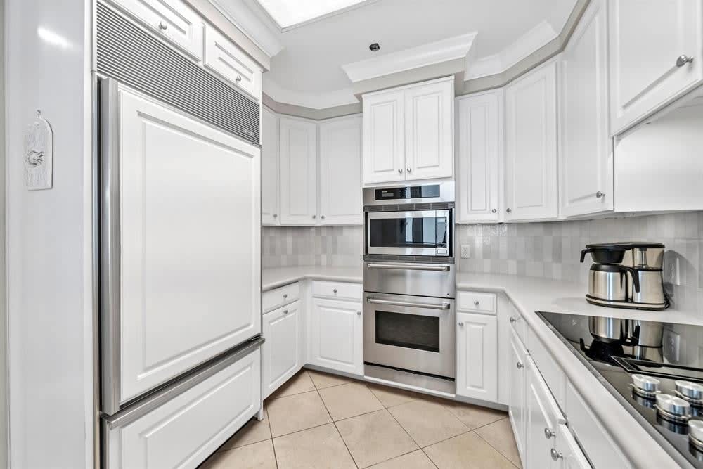 Conventional/convection oven, microwave, and a warming oven & electric cooktop