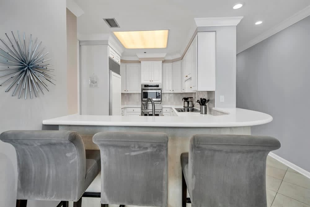 The kitchen features a Sub-zero refrigerator and lots of counter space