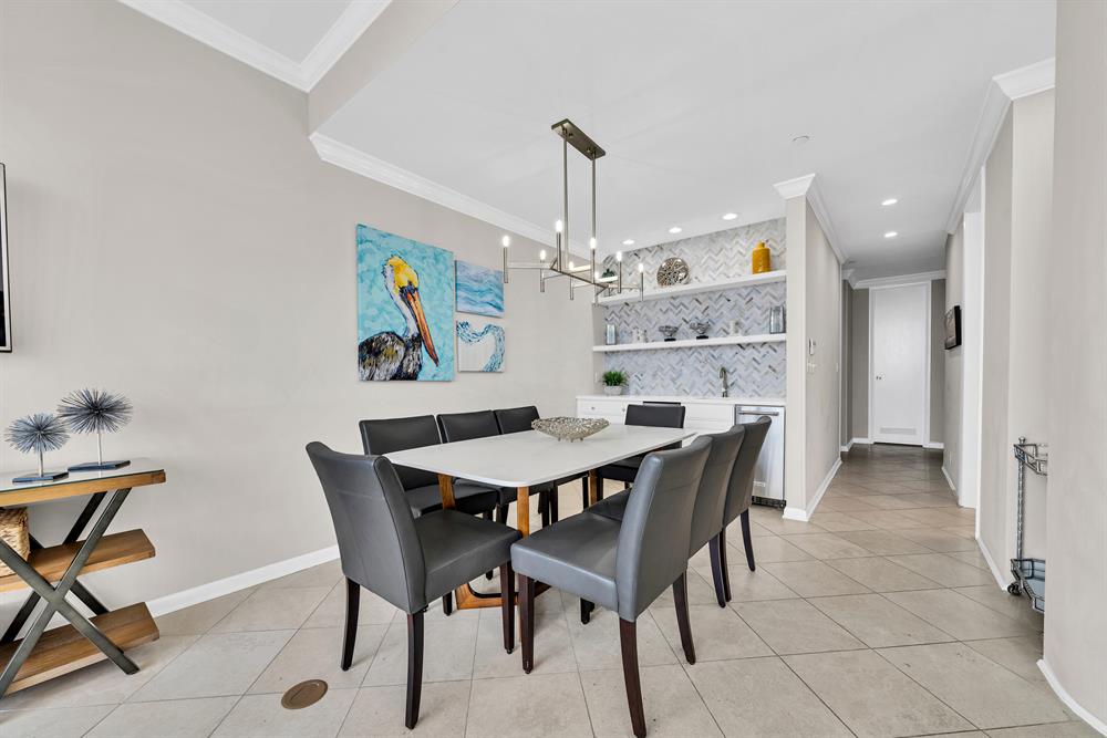 Dining area with wet bar & ice maker - comfortable seating for eight.