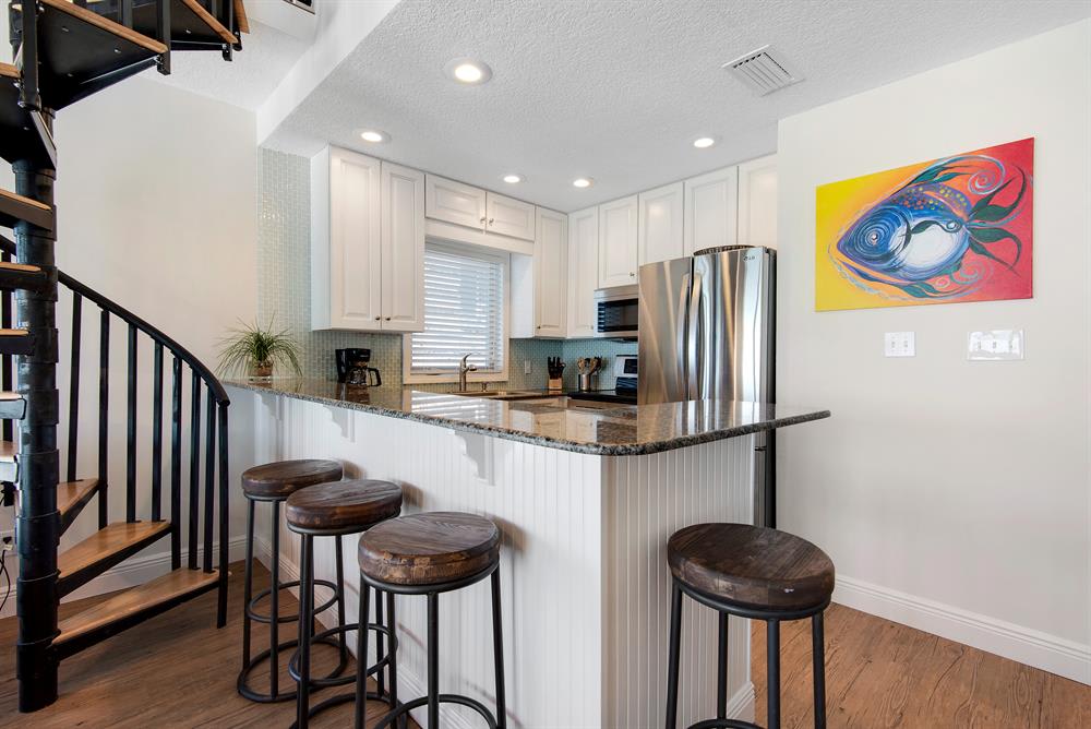 Large island bar with bar stools for carefree dining!