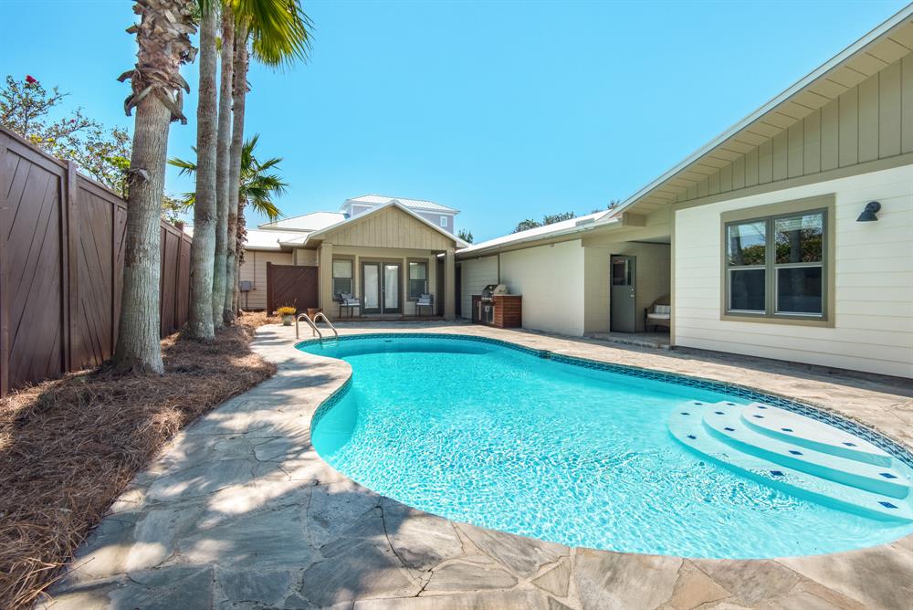 The home and carriage house surround the pool - creating a private oasis to enjoy!