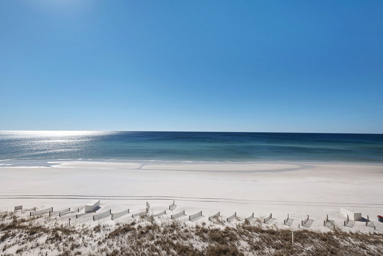 Beachfront luxury!  Enjoy the sea breezes from your balcony anytime.