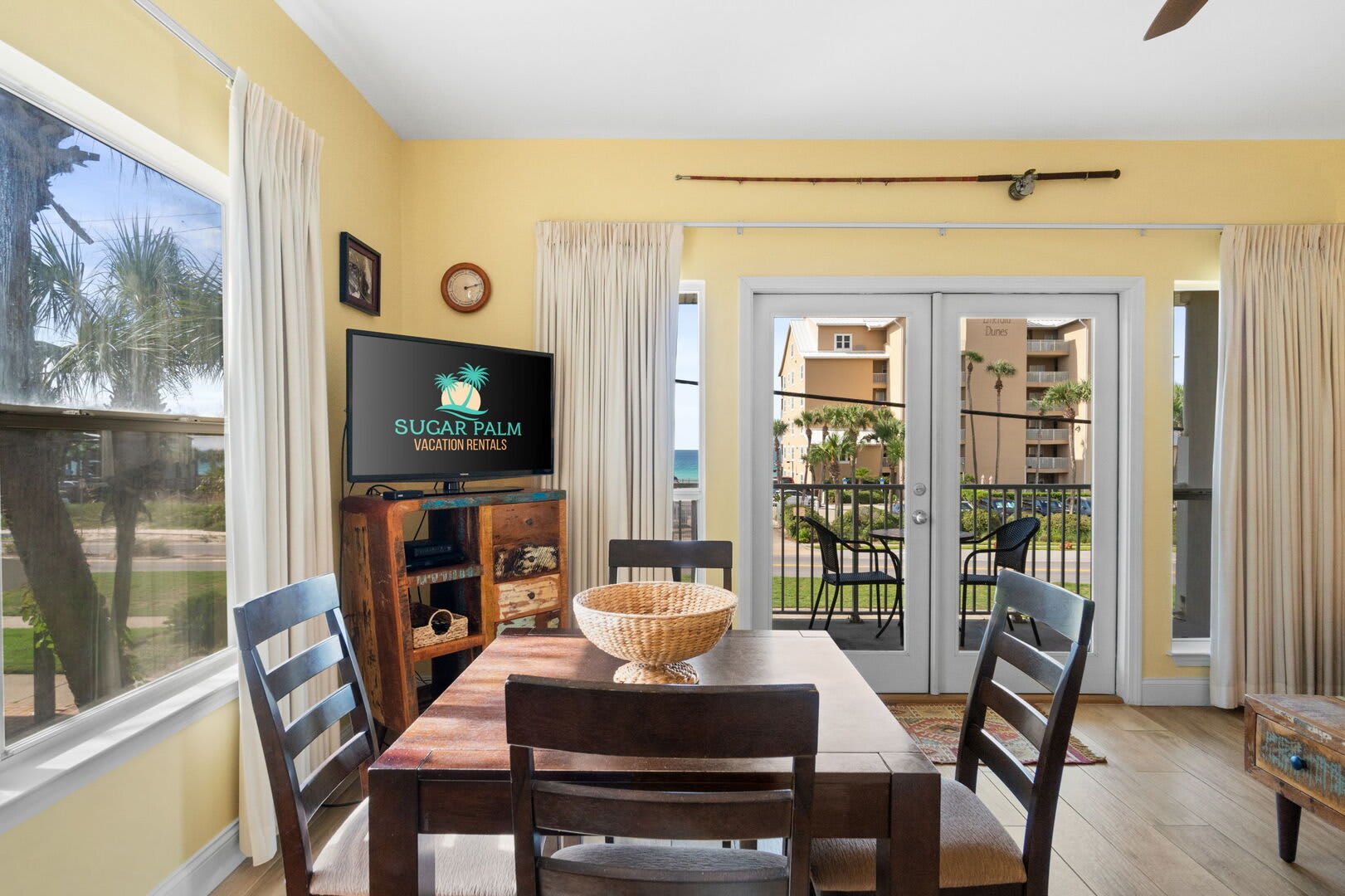 Gather at the table with ocean views and seamless access to the living room and kitchen.