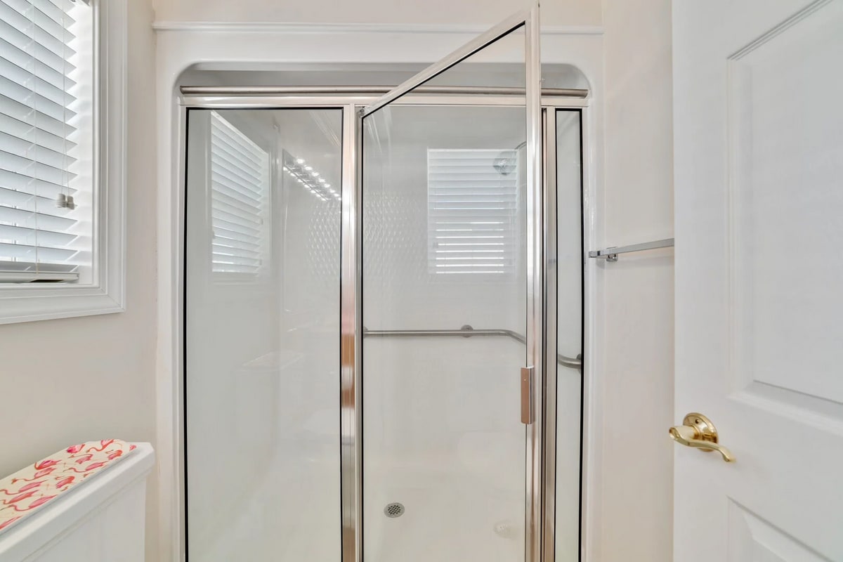 The private bathroom attached to the King Suite provides a walk-in shower for convenience and ease.