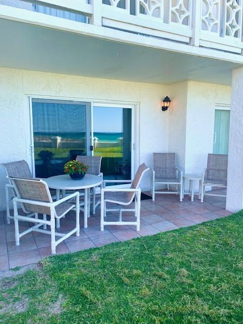 Lounge on your Patio Close to the Pool and Beach