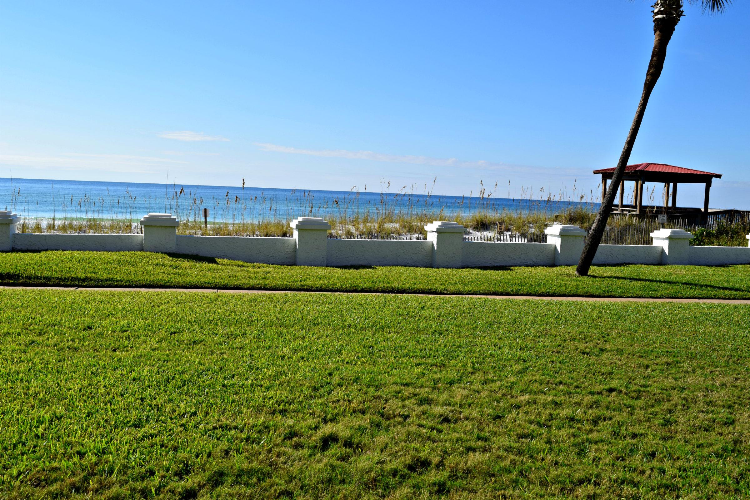 Actual view from the unit and the patio. Slip on your shades and stroll to the beach!