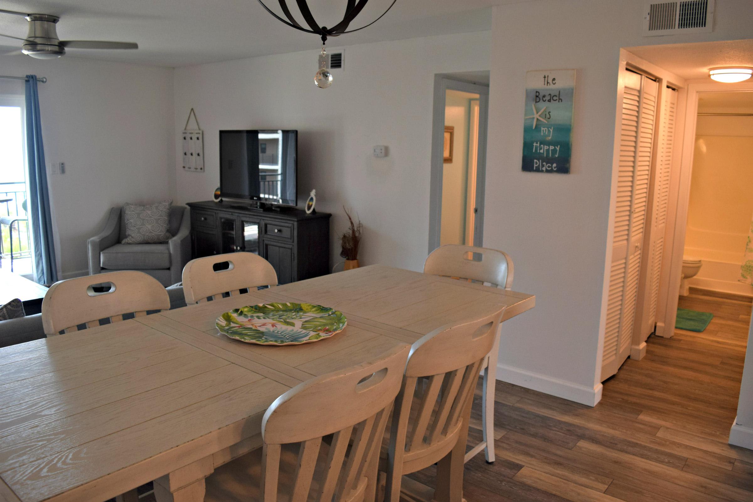 This shot shows the dining room and entries into the two bedrooms.