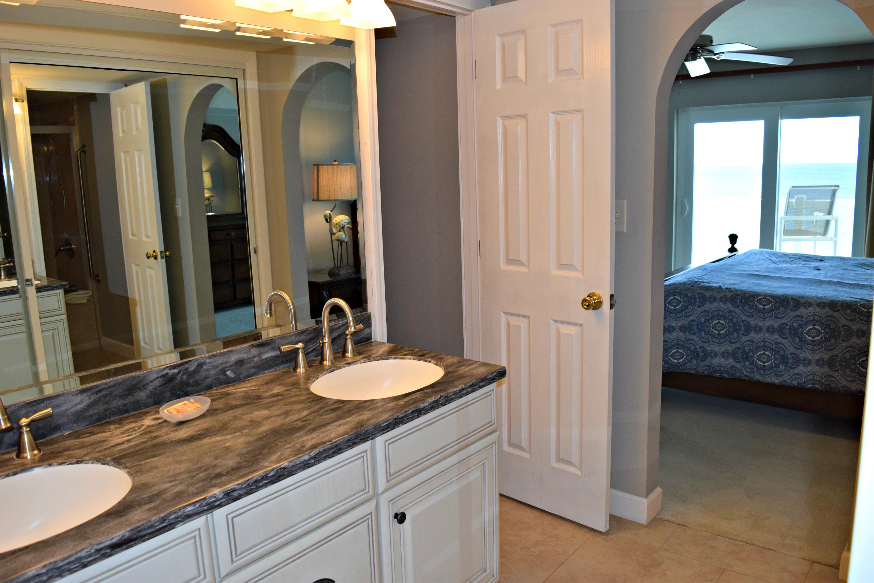 Master bath looking to the balcony and beach beyond.