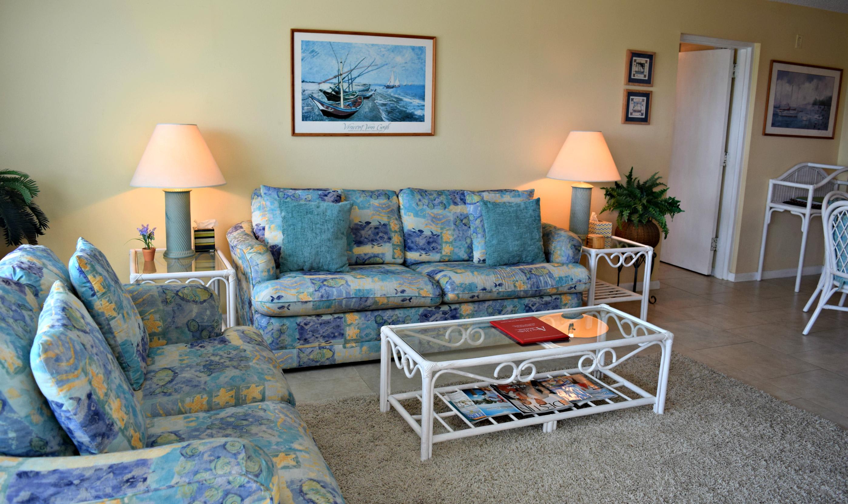 Beach colors with area rug over tiled floors.