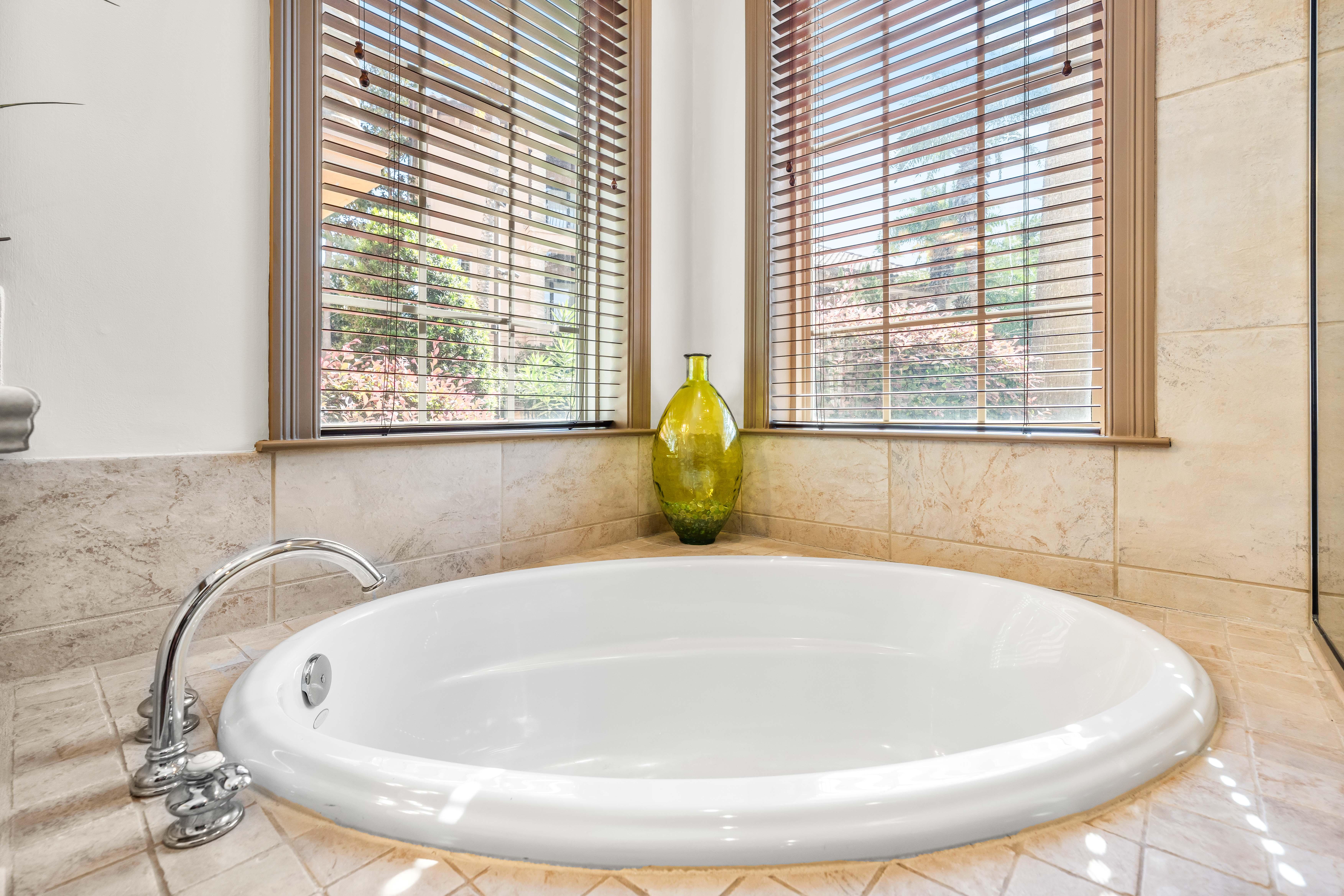 A bathtub perfect for soaking after a day at the beach. This bathroom is shared by the king bedroom and the bunk bedroom.