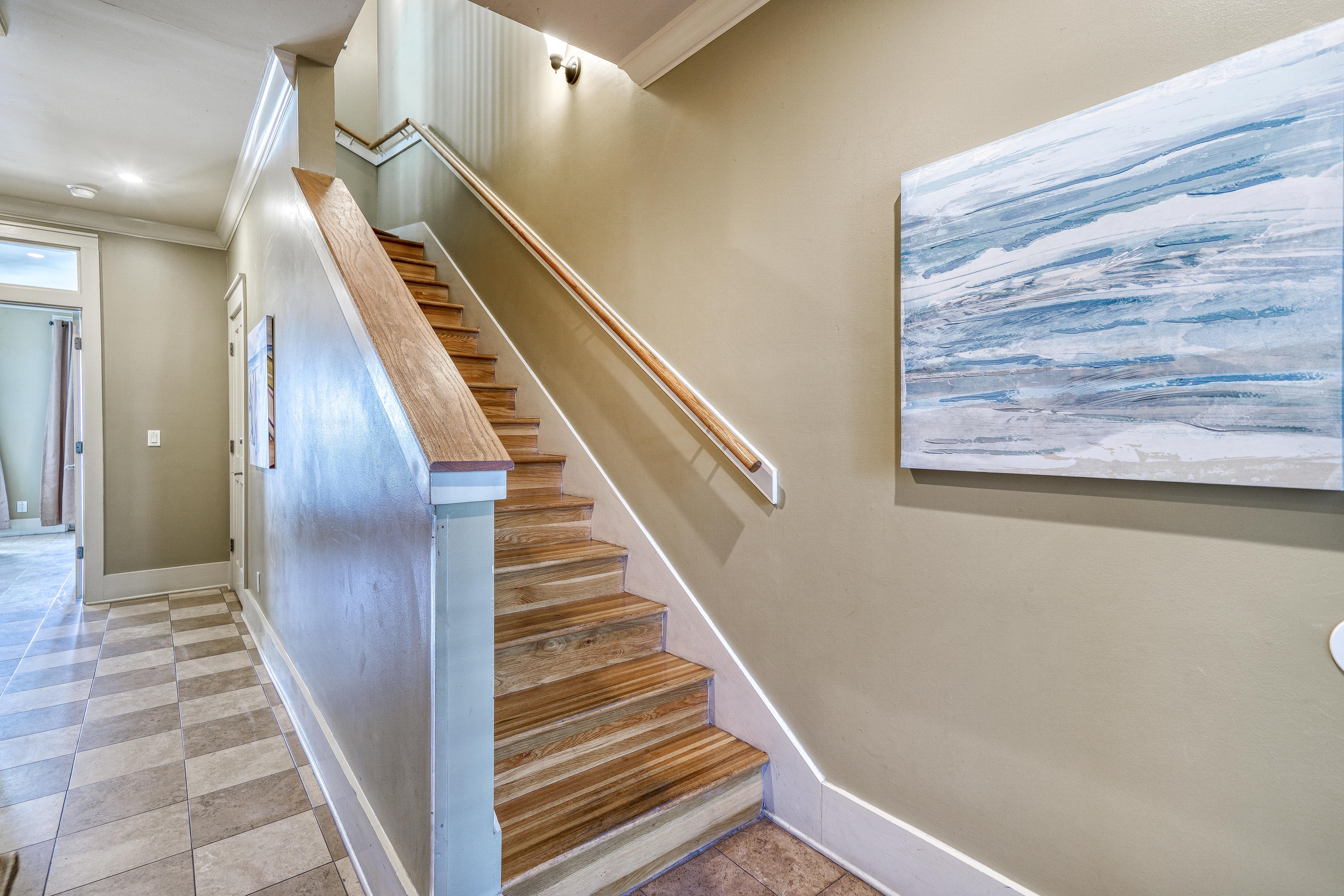 1st Floor Foyer with Whimsical Checkerboard Travertine Tile. Hardwood Floors on the Upper Floors