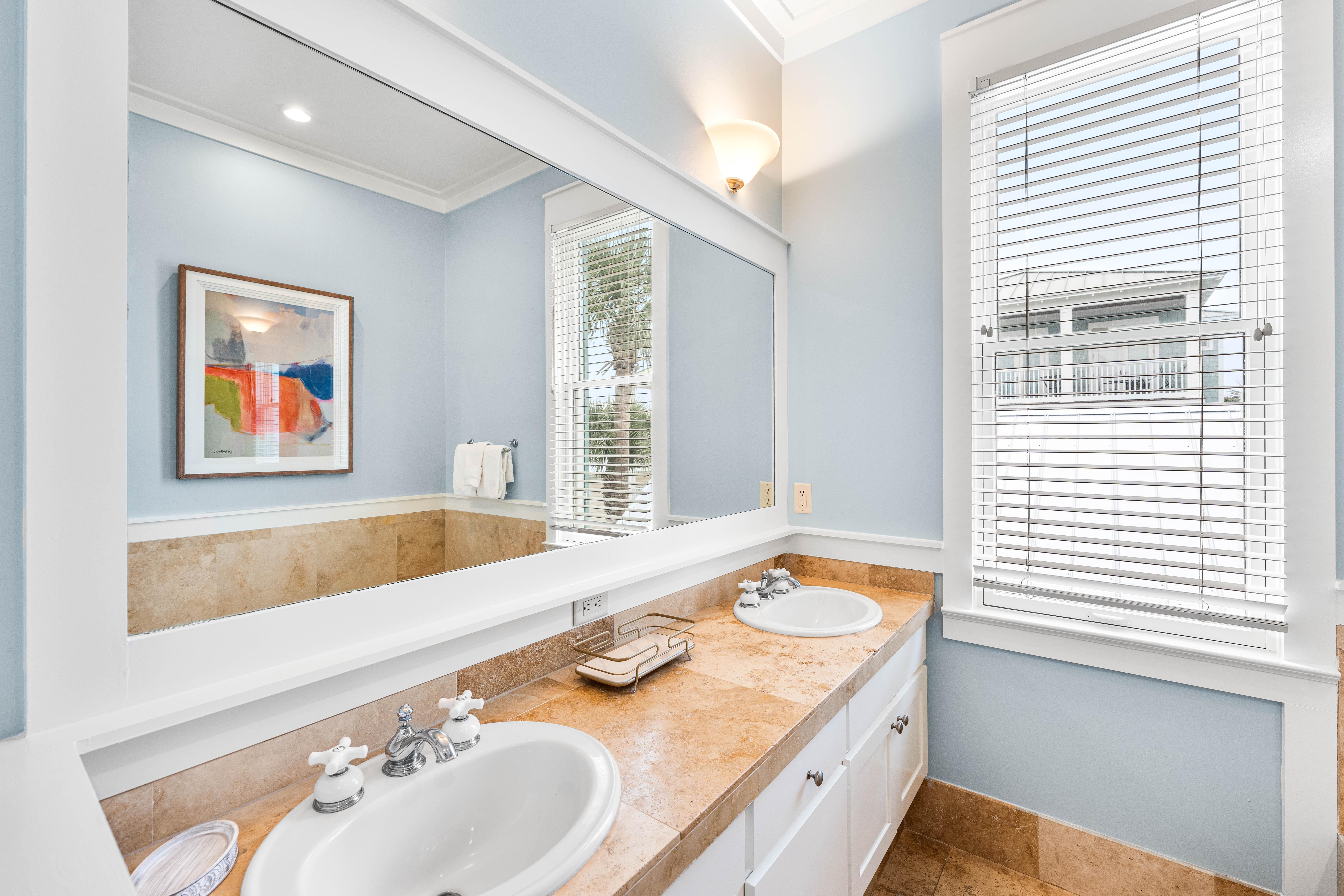 Primary Ensuite Bathroom for the King Bedroom has Soaking Tub, Walk-In Shower, Double Vanities, & Water Closet.