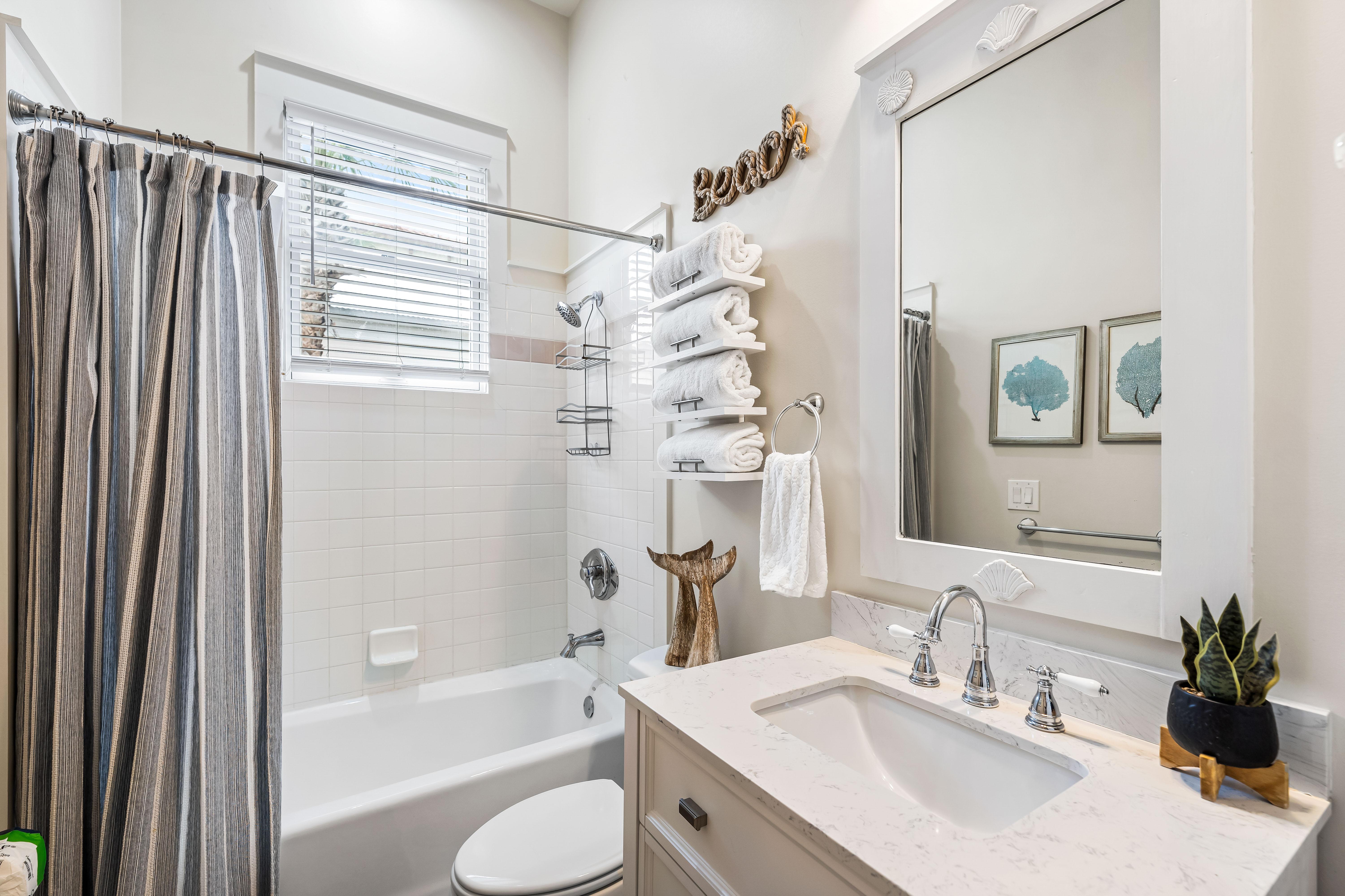 Full bathroom off the bunk bedroom with additional access from the hallway.  Linen closet stores your green & white beach towels.