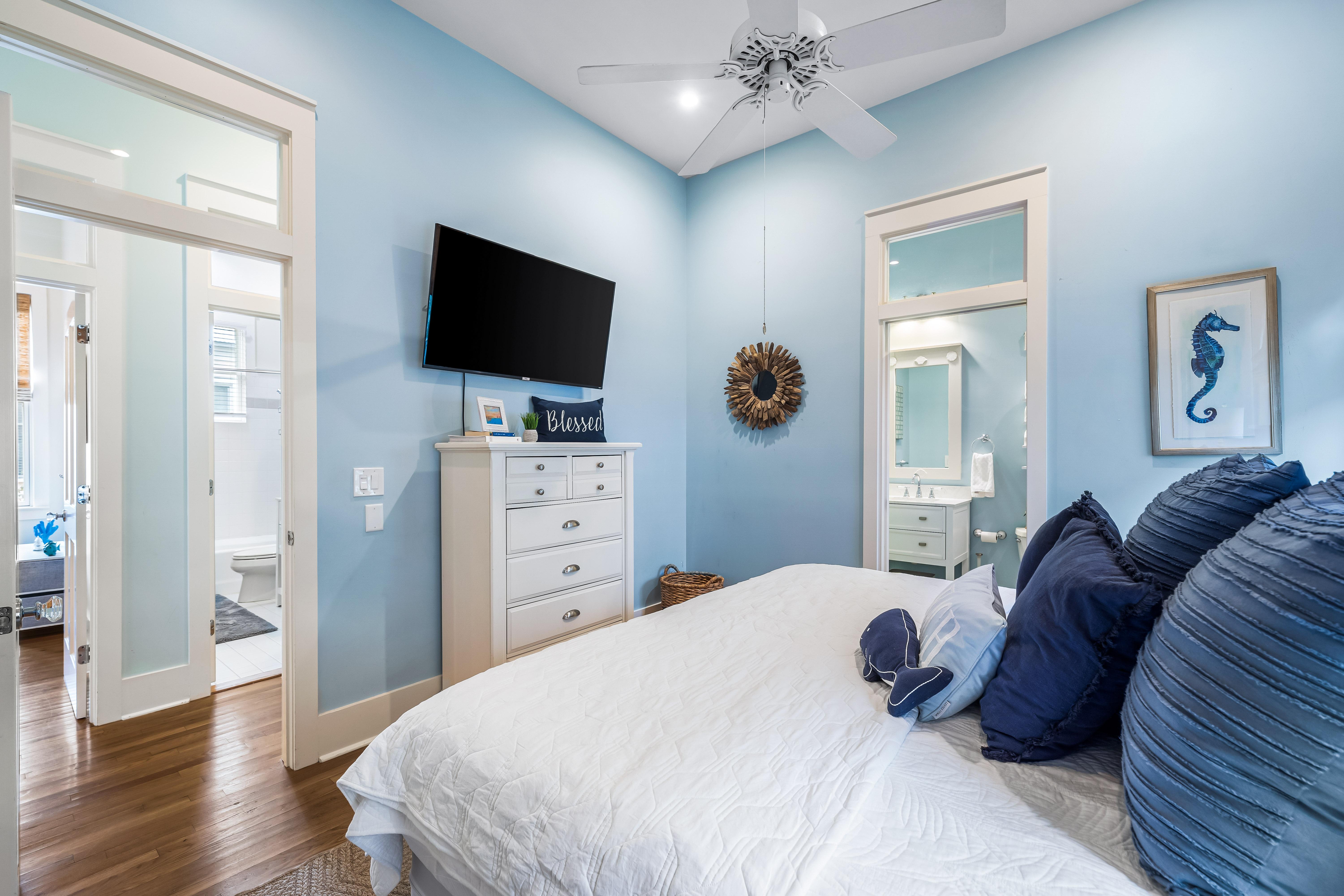 A true coastal cottage with high ceilings and transom windows over the doors to brighten this home with natural light.