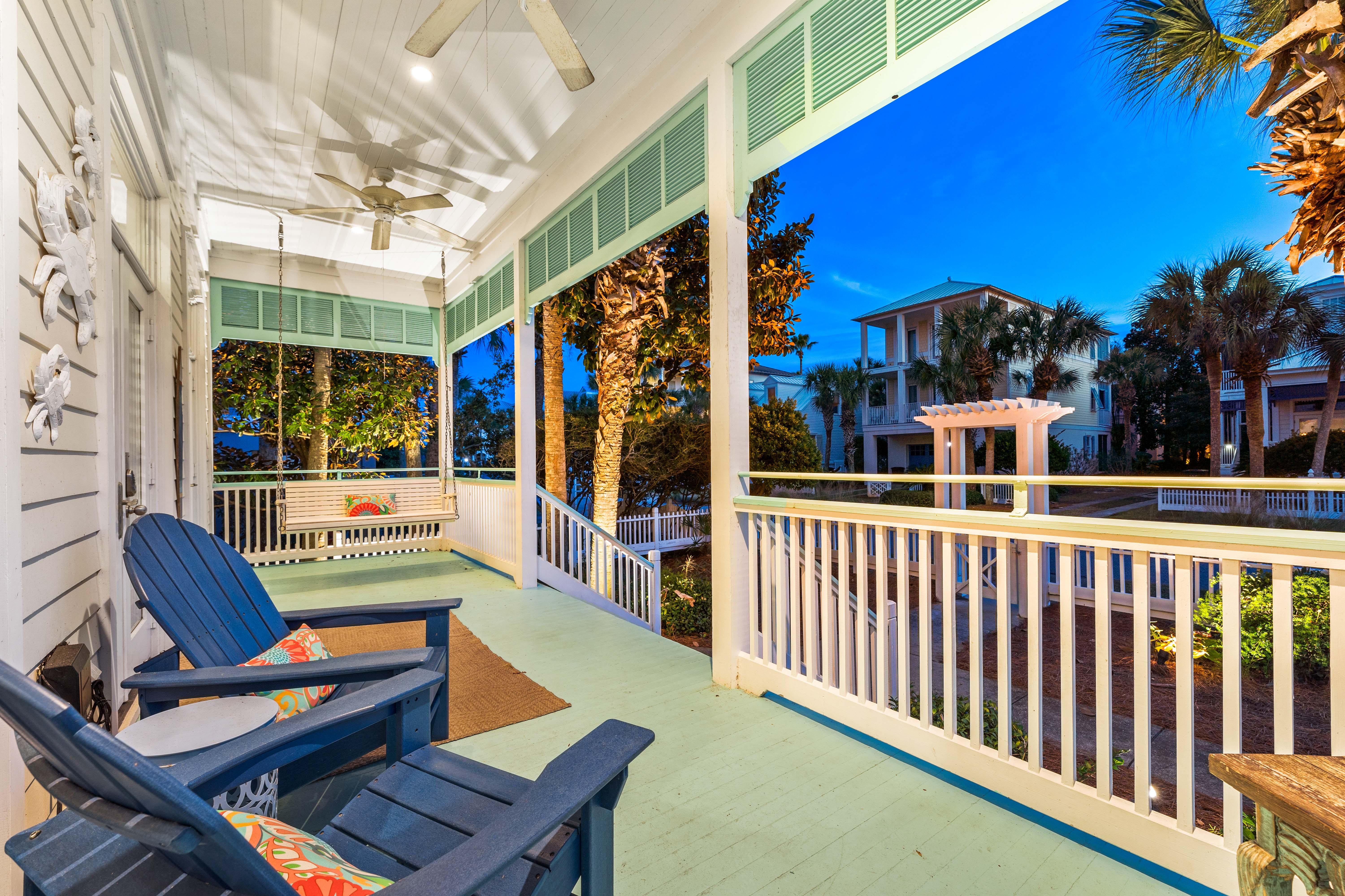This colorful "Old Florida" front porch provides a welcoming entrance and a sense of nostalgia. Evenings spent on the porch bring lasting memories!