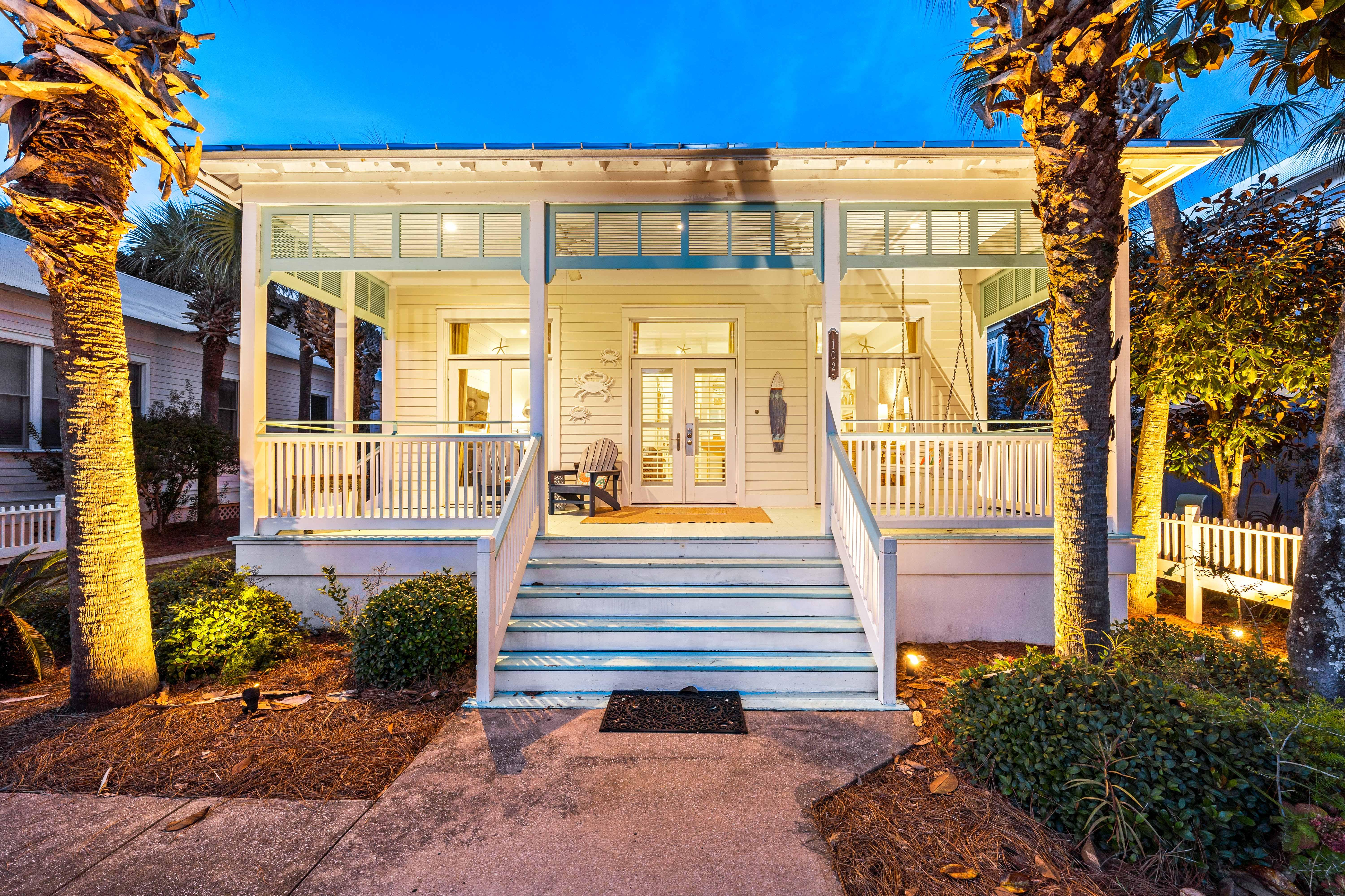 A welcoming classic coastal cottage with hardwood floors, high ceilings, front porch & ceiling fans throughout.
