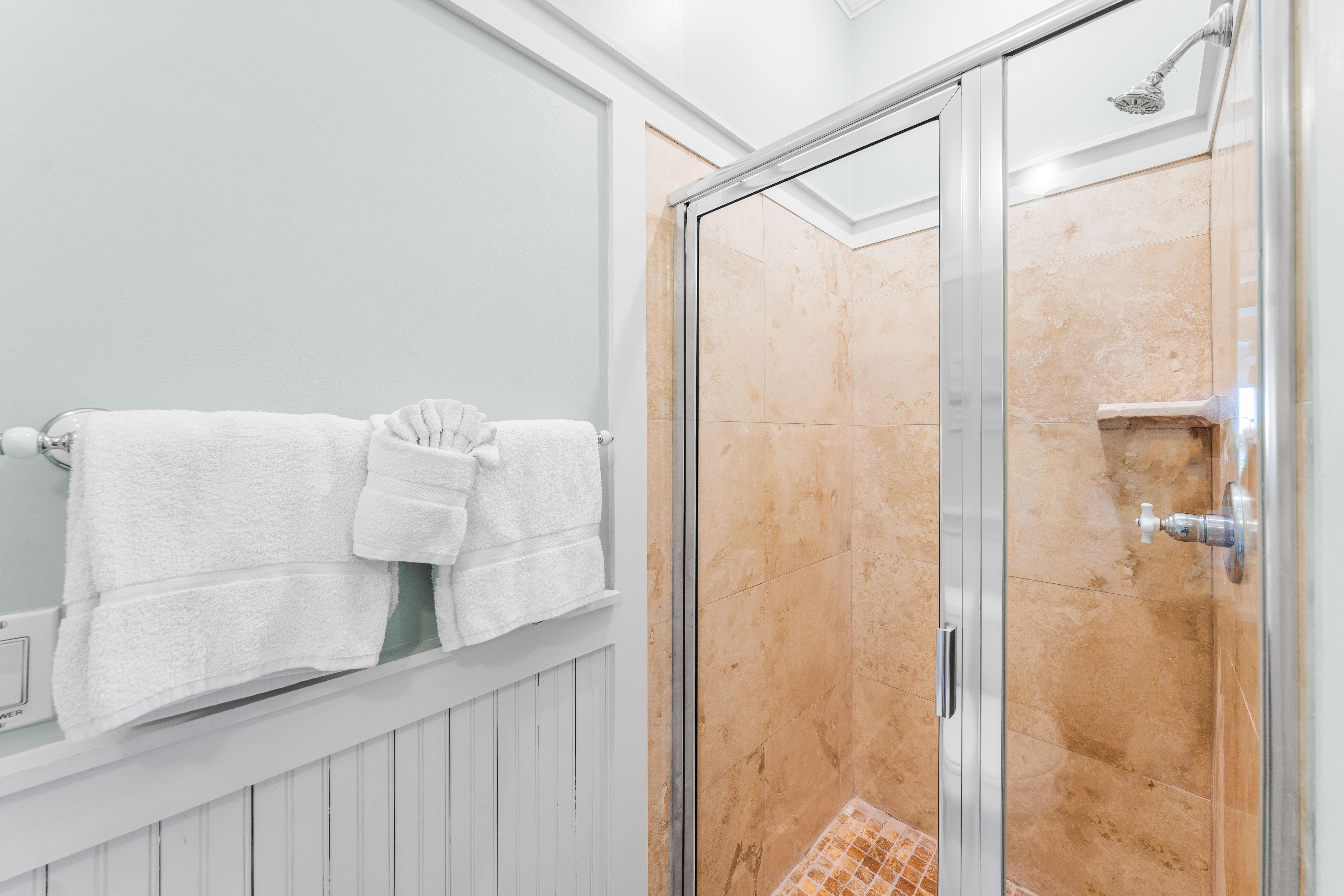 Natural stone walk-in shower in this 2nd floor ensuite bathroom