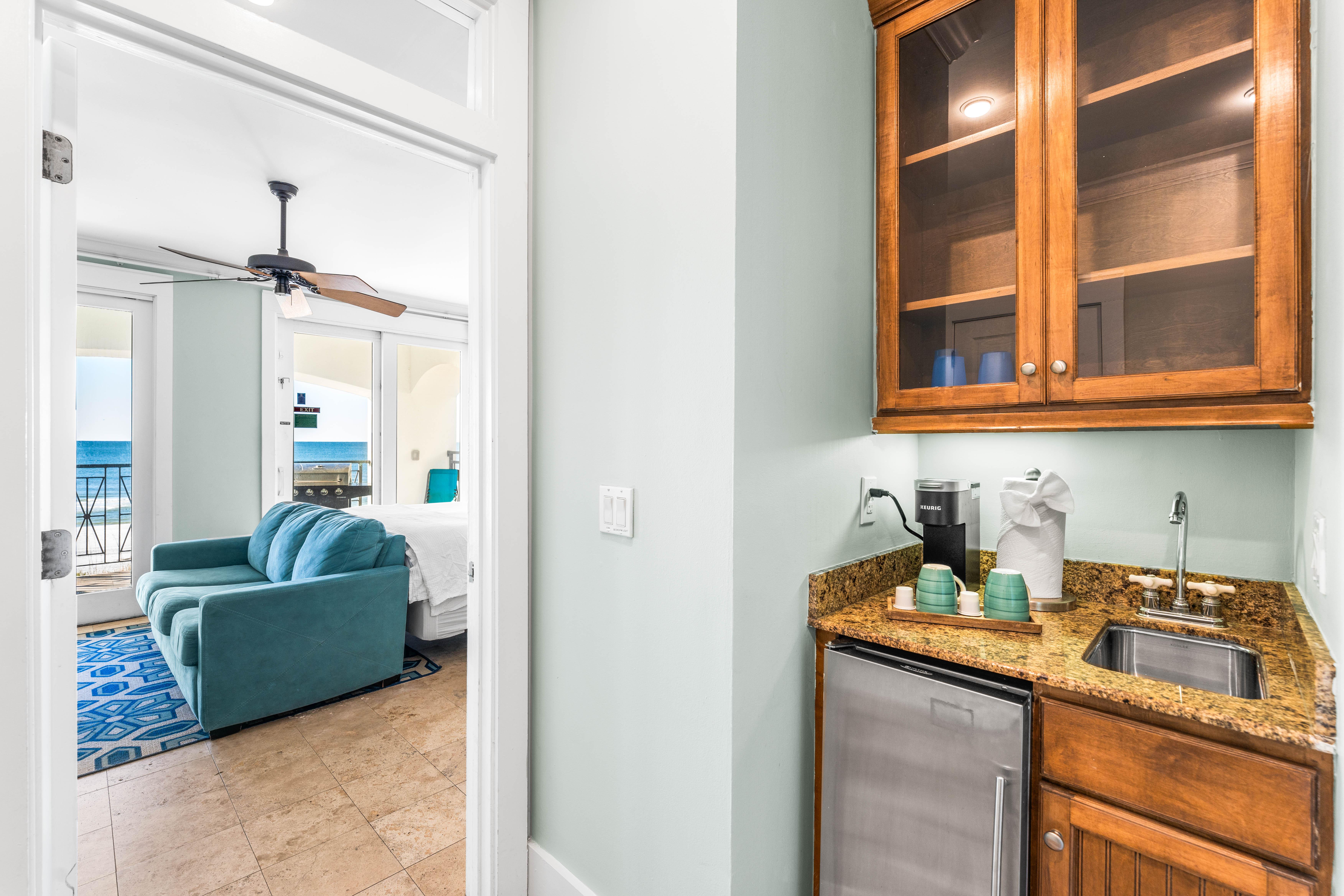 Wet bar on the 1st floor with beverage cooler and Keurig coffee maker.