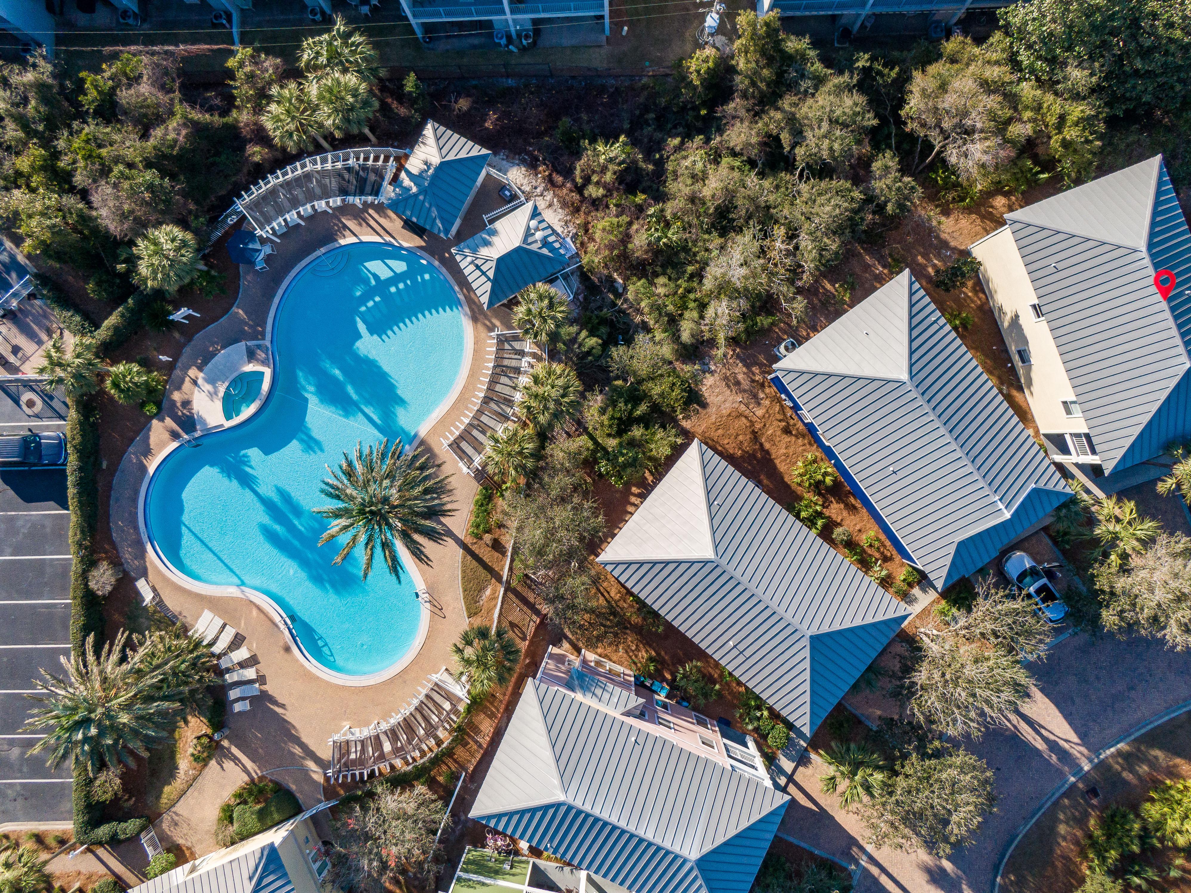 Giant lagoon style pool with separate heated spa for this small family-friendly gated community.