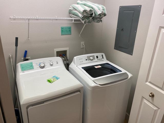 1st floor hall closet opens up with a full size washer and dryer