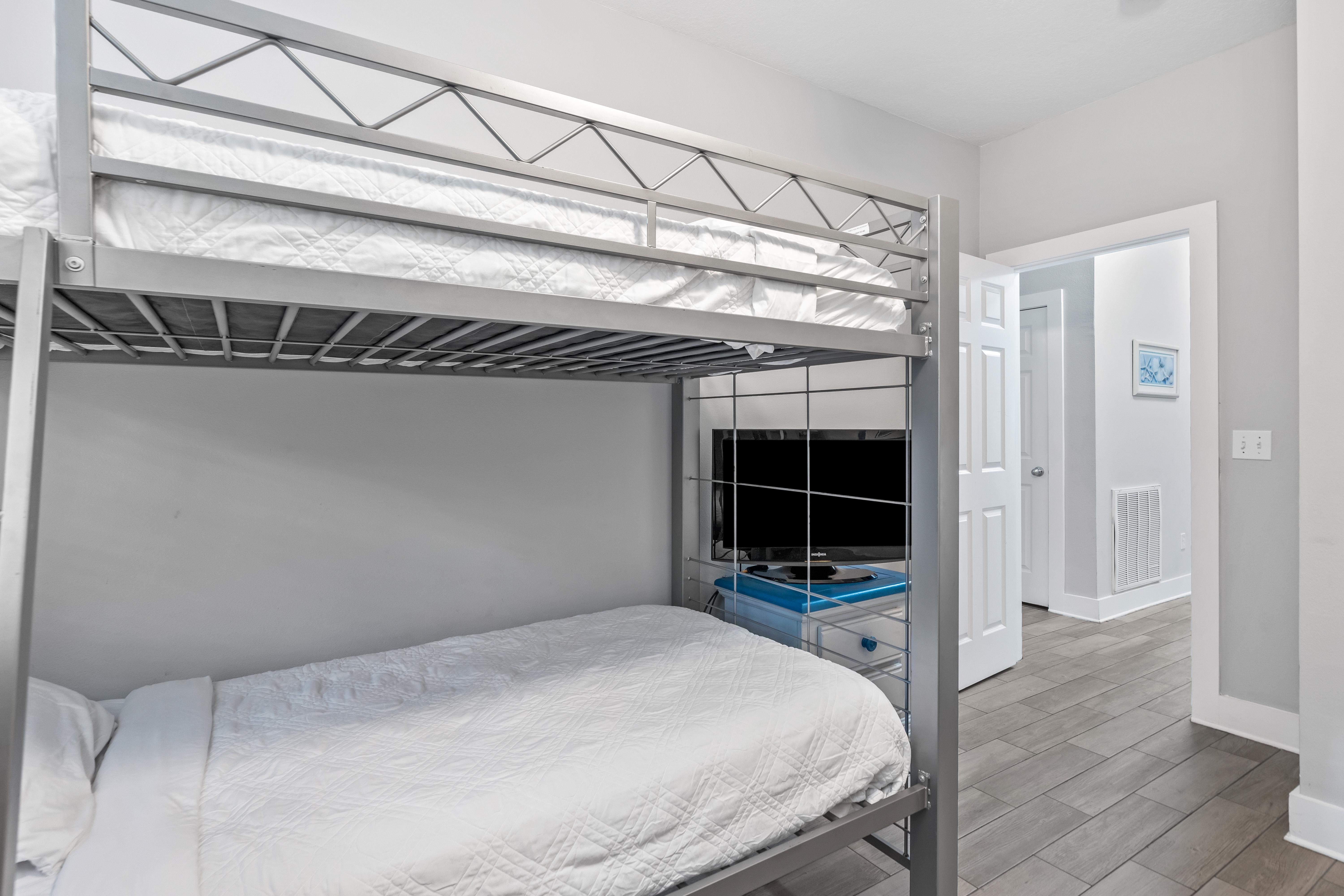 First floor bunk bedroom with 2 sets of twin over twin beds & a 31" tv with cable.