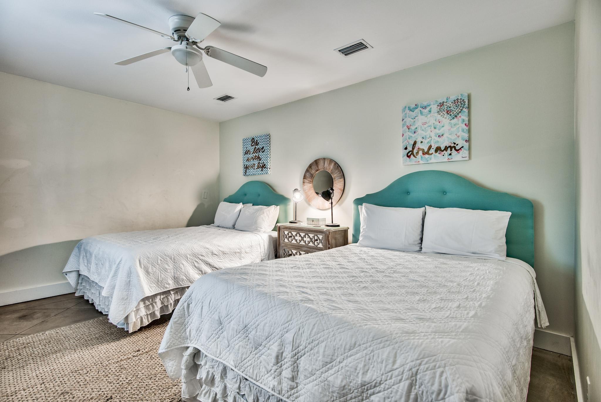 East end of Seabreeze has a 2nd bedroom with 2 queen beds & adjacent full bathroom with a walk-in shower.