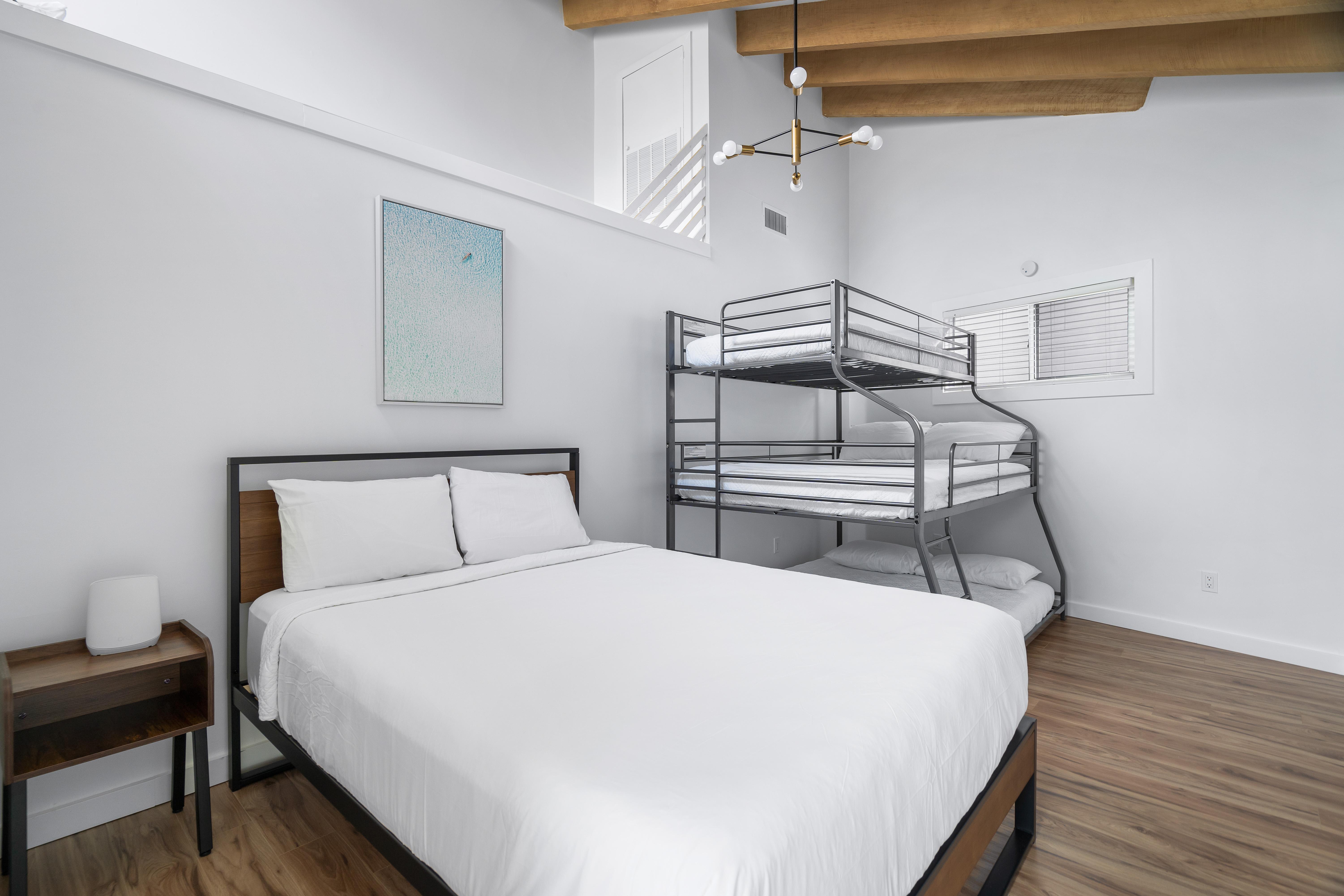 Queen bed with triple bunk, queen on the bottom,a full in the middle and twin on top with en suite bath. Bedroom #4