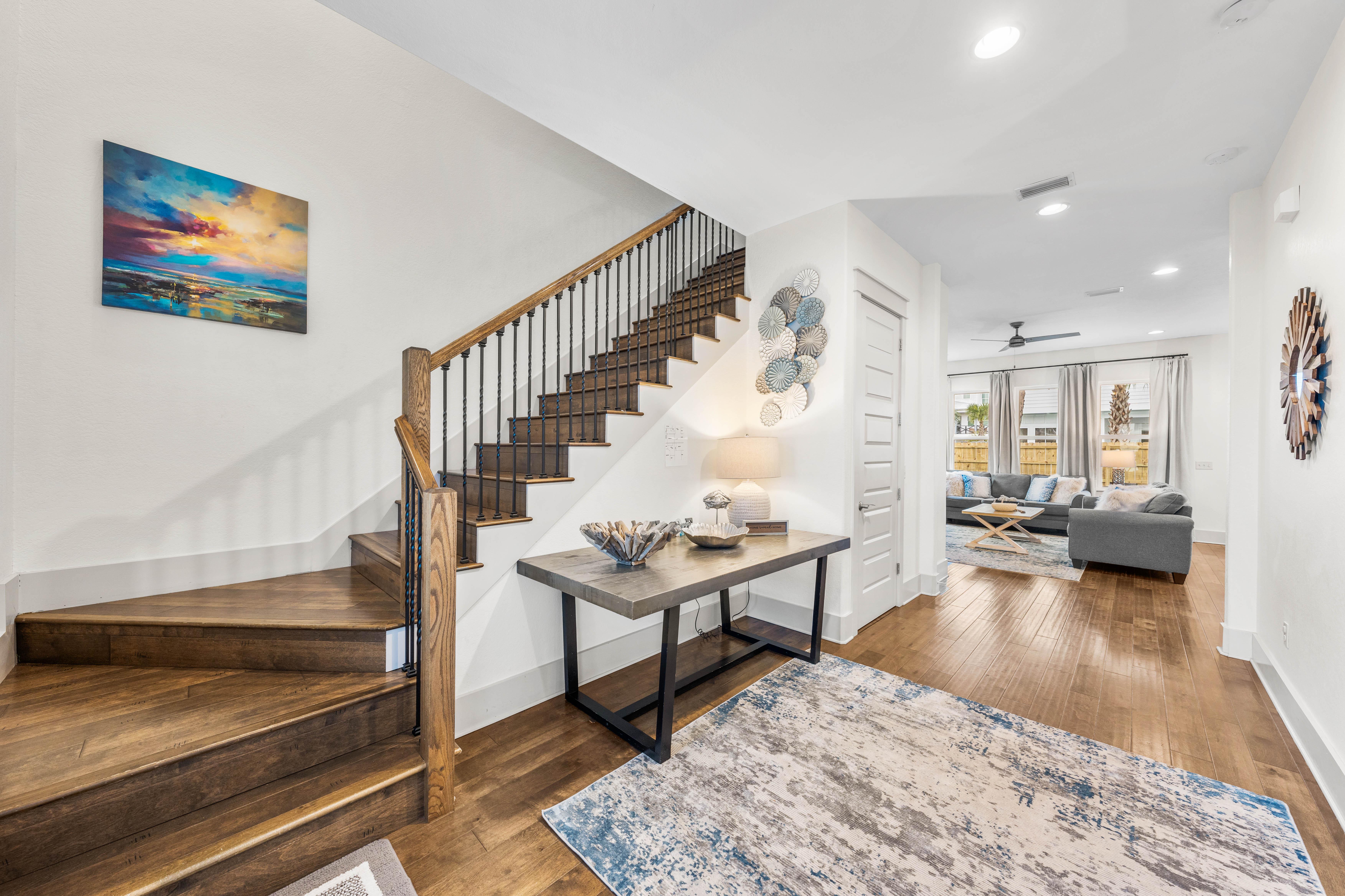 Spacious foyer leading into the main living, dining area & kitchen  King bedroom off to the right and a full bathroom to the left. Hardwood floors throughout.