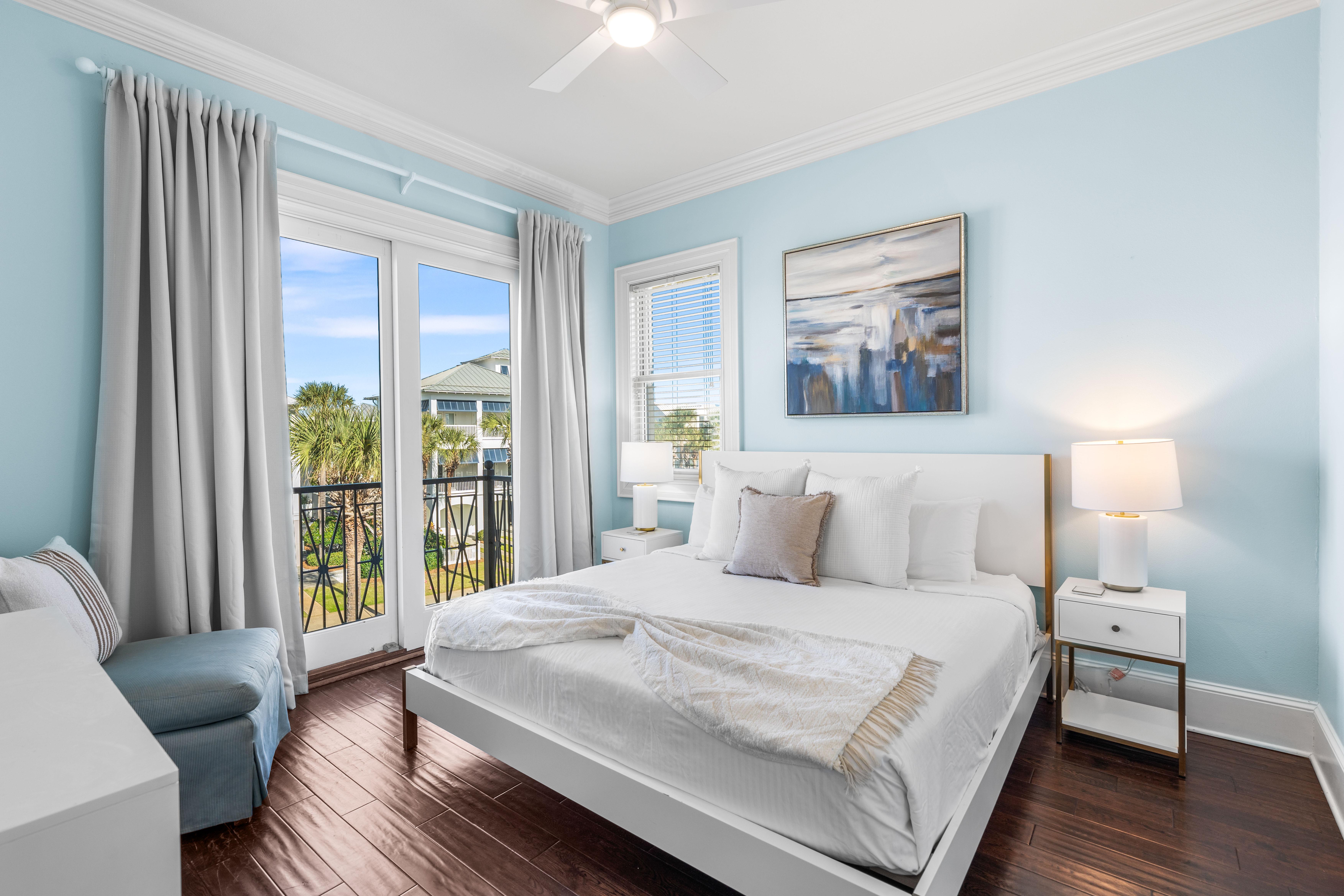 Third Floor Bedroom with King Bed, 40" TV, Ensuite Bathroom with Bathtub/Shower Combination & Balcony Overlooking the Frangista Beach Community.