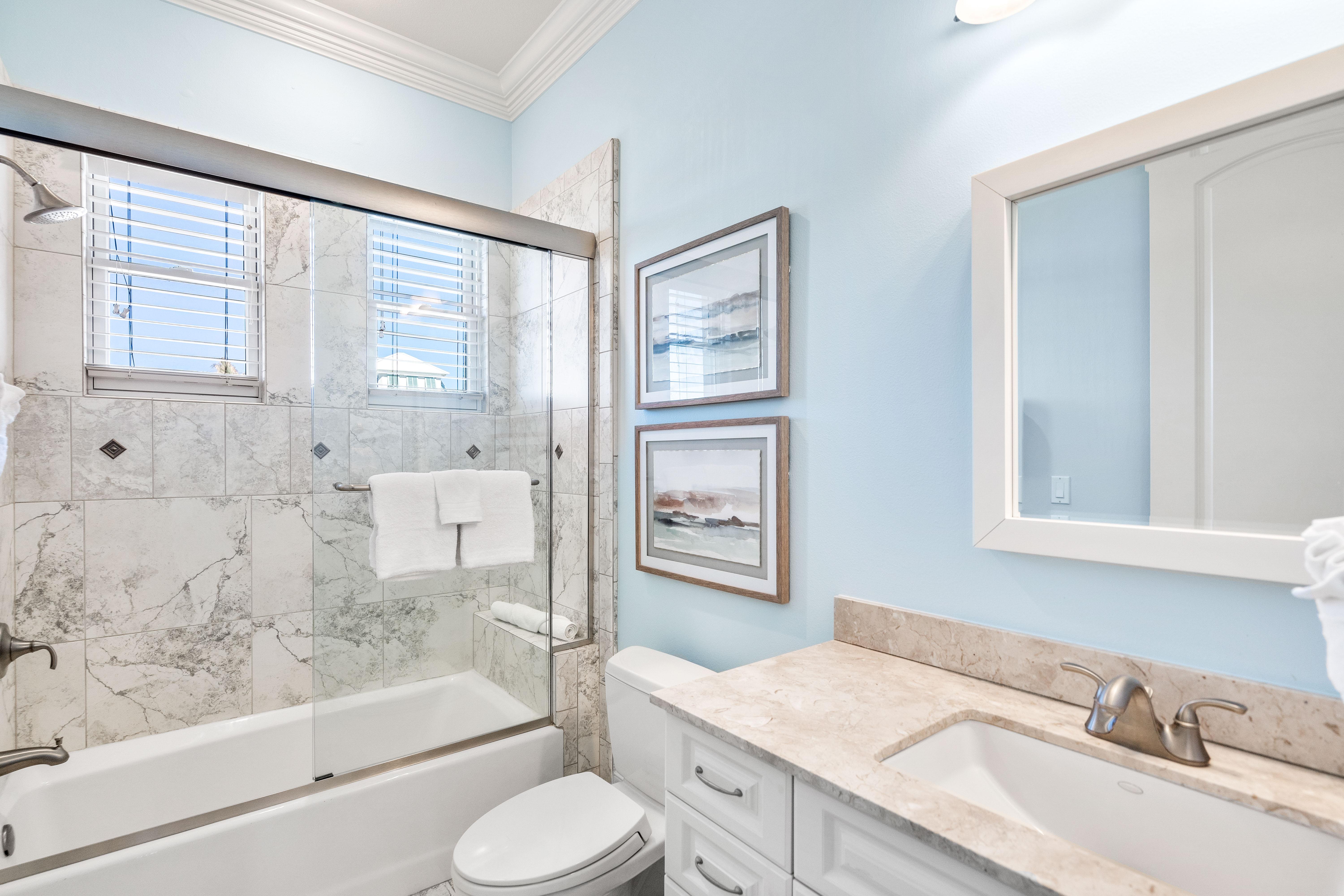 Third floor ensuite bathroom for the guest king bedroom with a bathtub/shower combination.