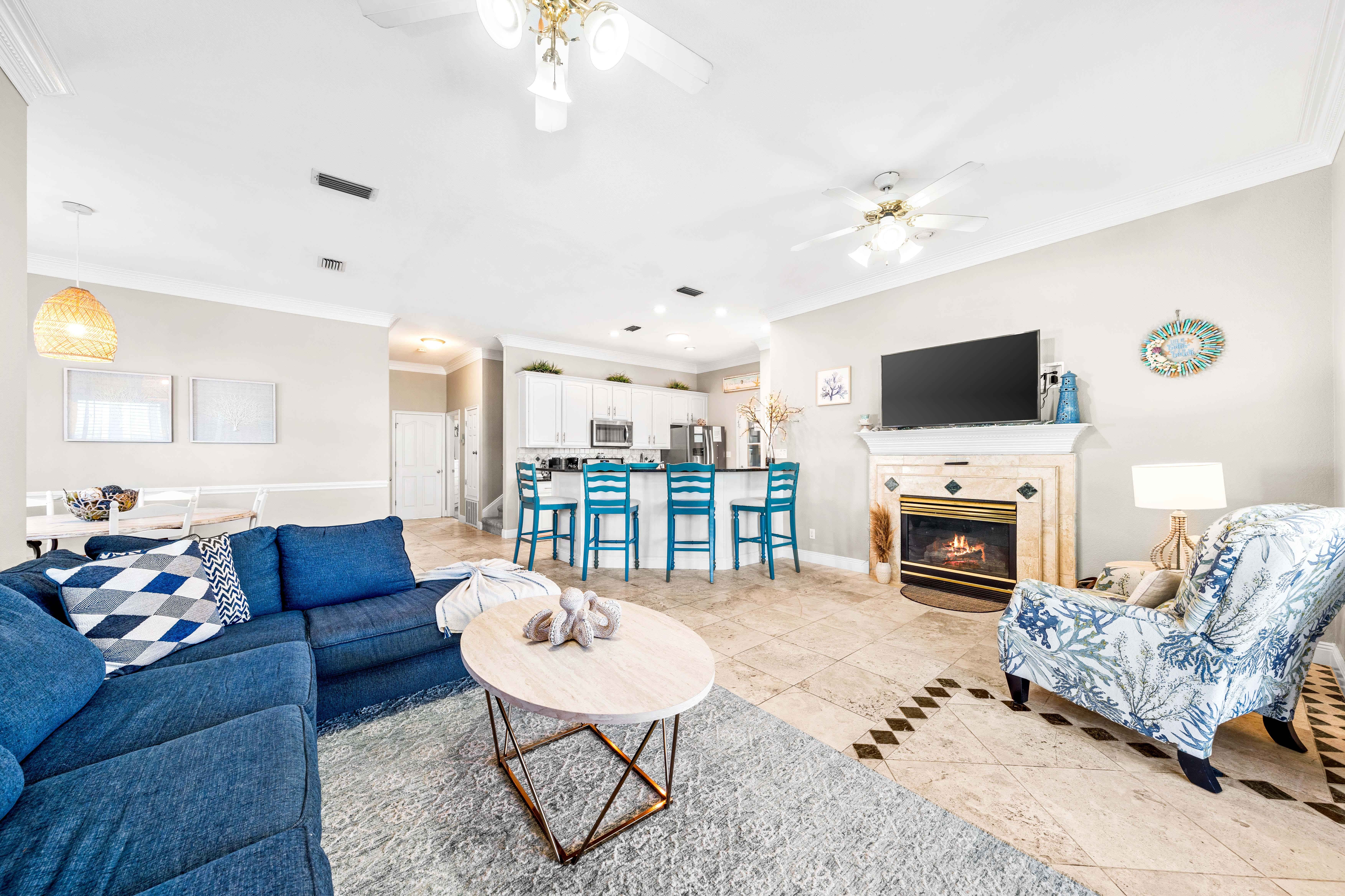 Open Living Room, Kitchen and Dining Area with 55" Smart TV with Cable.