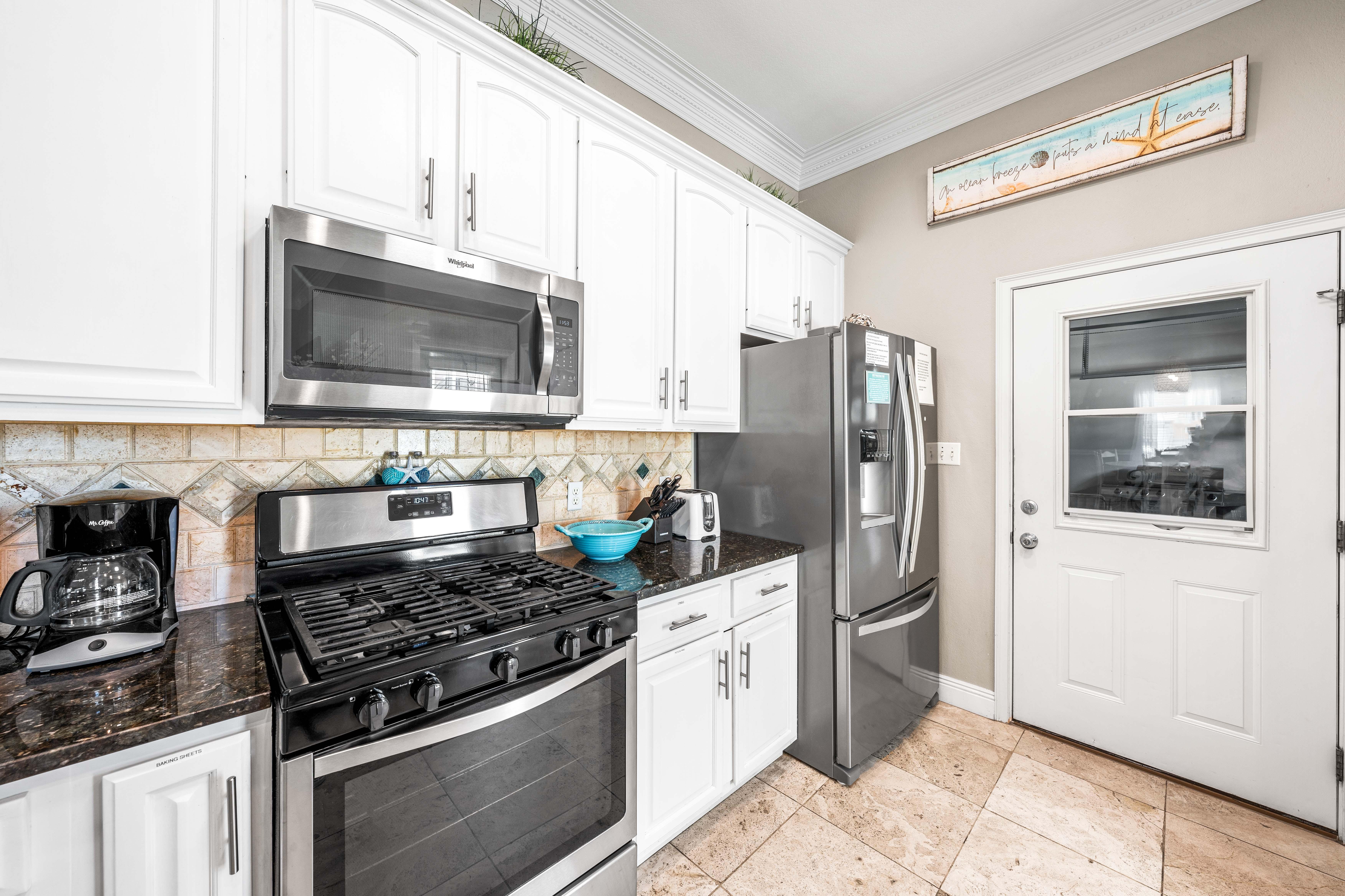 Gas range!   Stainless steel appliances and granite countertops.
