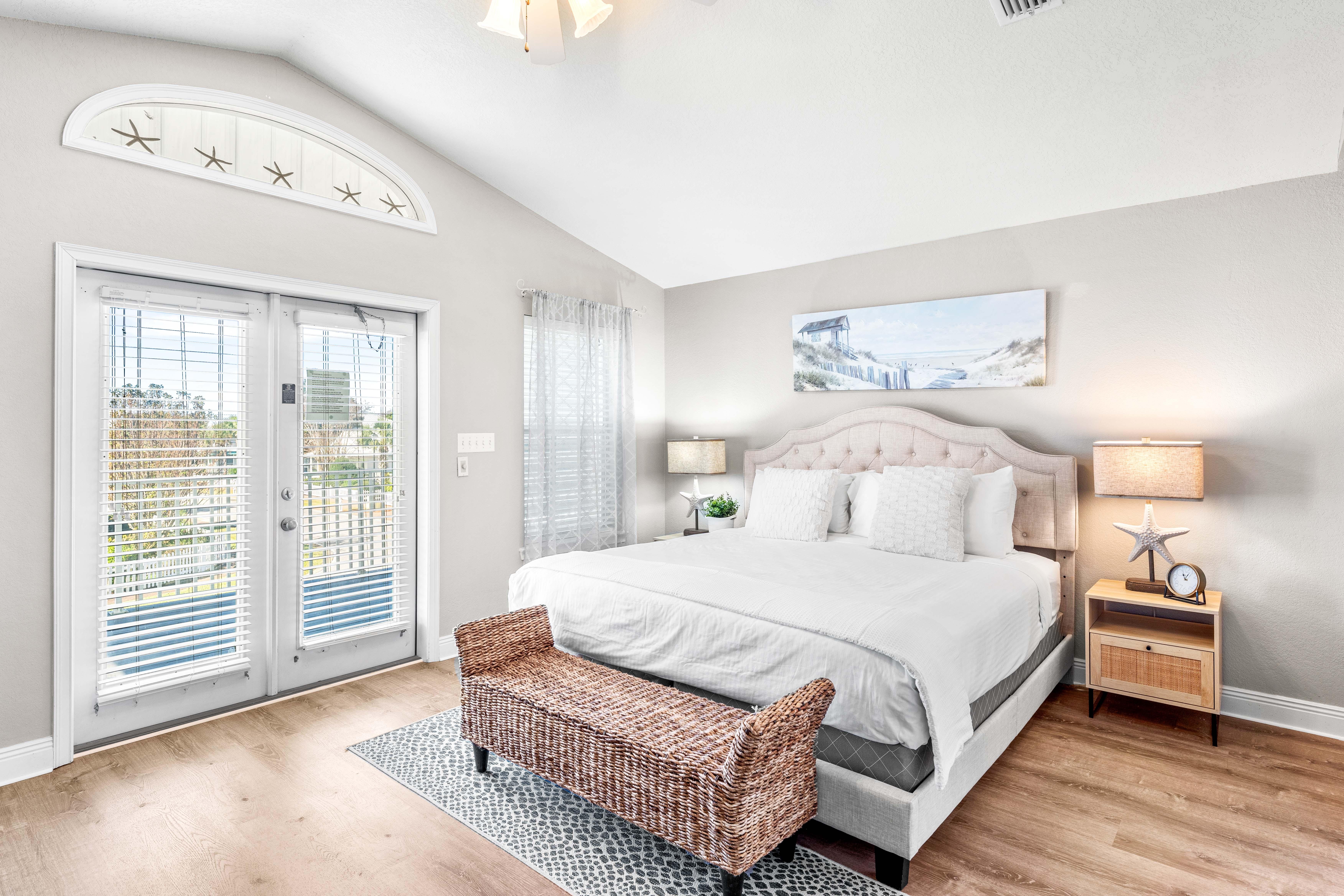 Primary King Bedroom with Private Balcony, Ensuite Bathroom, and 55" Smart TV