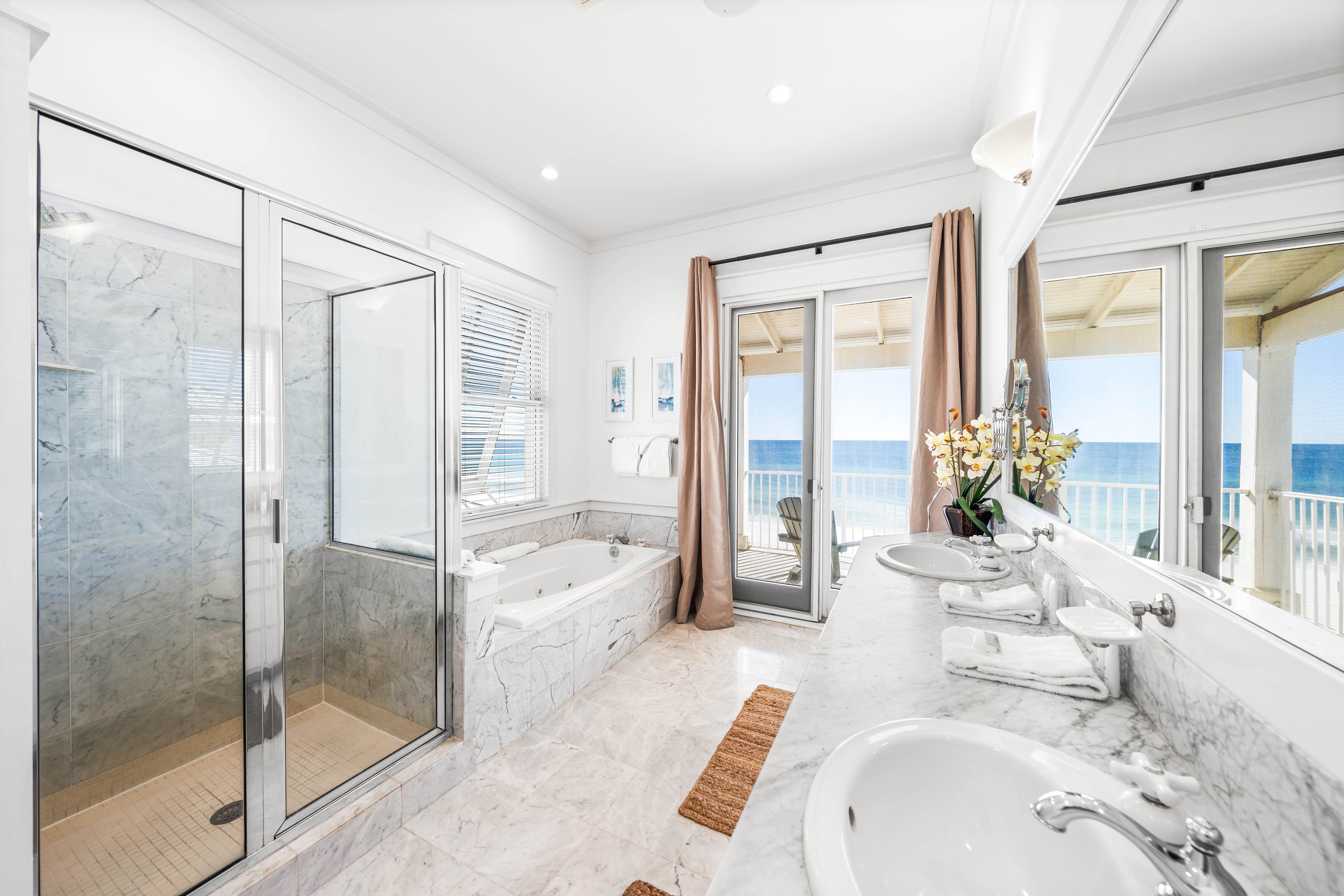 Walk-in shower, jetted tub, two sinks, marble vanity and one stunning view!   This is your primary ensuite bathroom on the 3rd floor